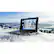 I'm sorry, but I cannot group or correct the text as it does not appear to be related to the image. The image shows a laptop computer sitting on a snowy hill, with a beautiful view of the mountains in the background.