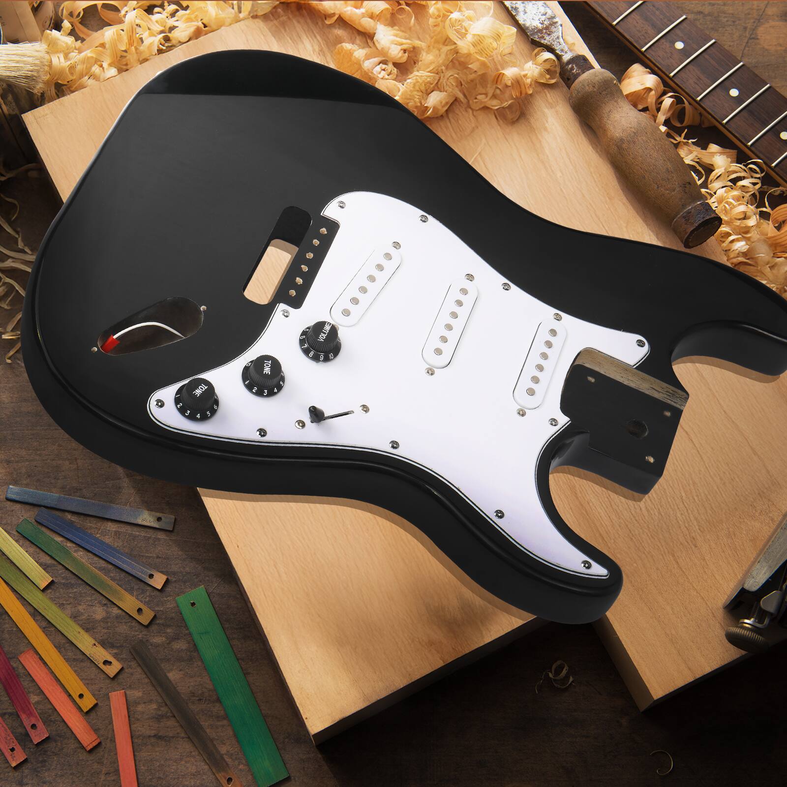 The text on the image is:

- "TONE"
- "VOLUME"