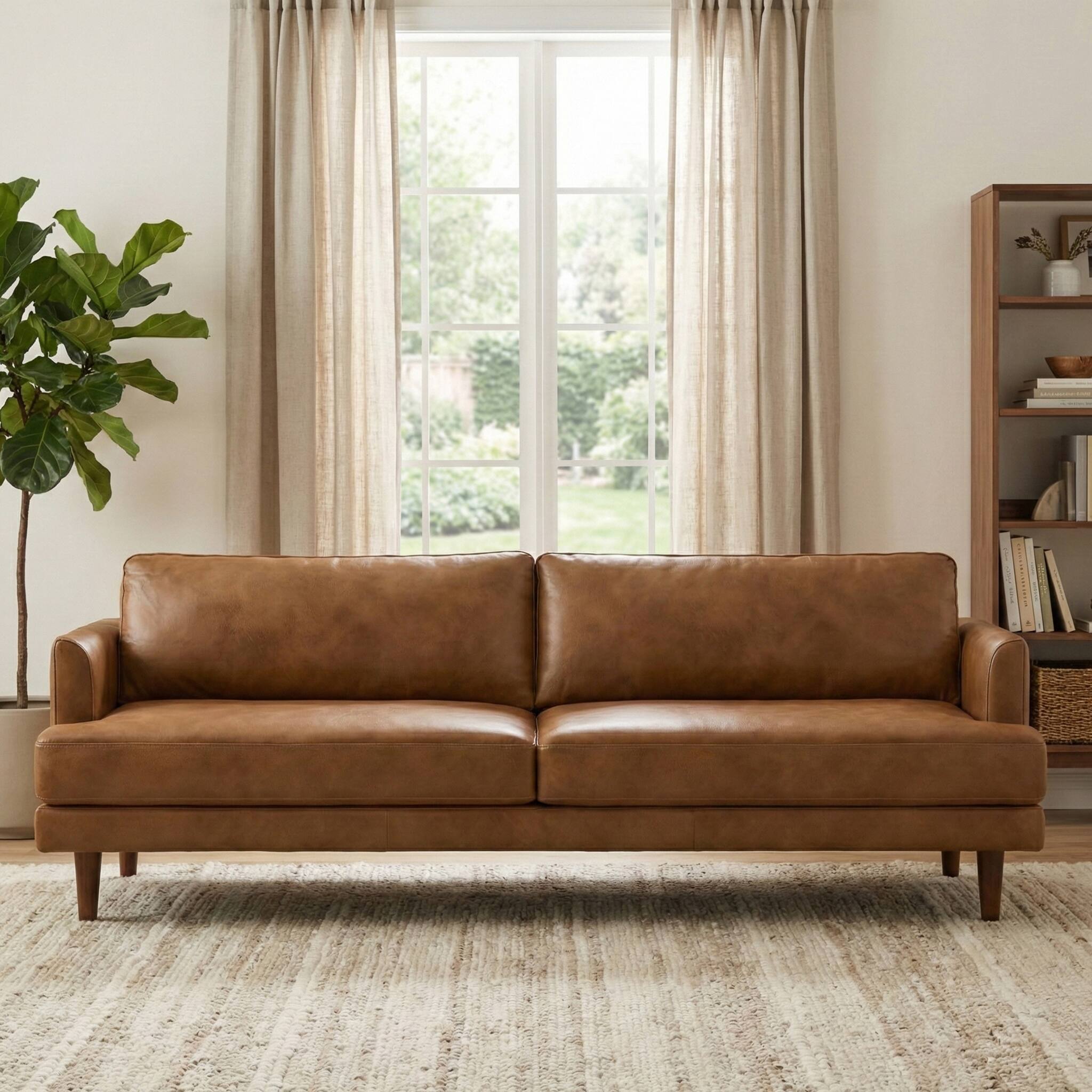 Angle. Simpli Home - Livingston 90 inch Wide Mid-Century Modern Sofa in Caramel Brown Top Grain Genuine Leather - Caramel Brown.