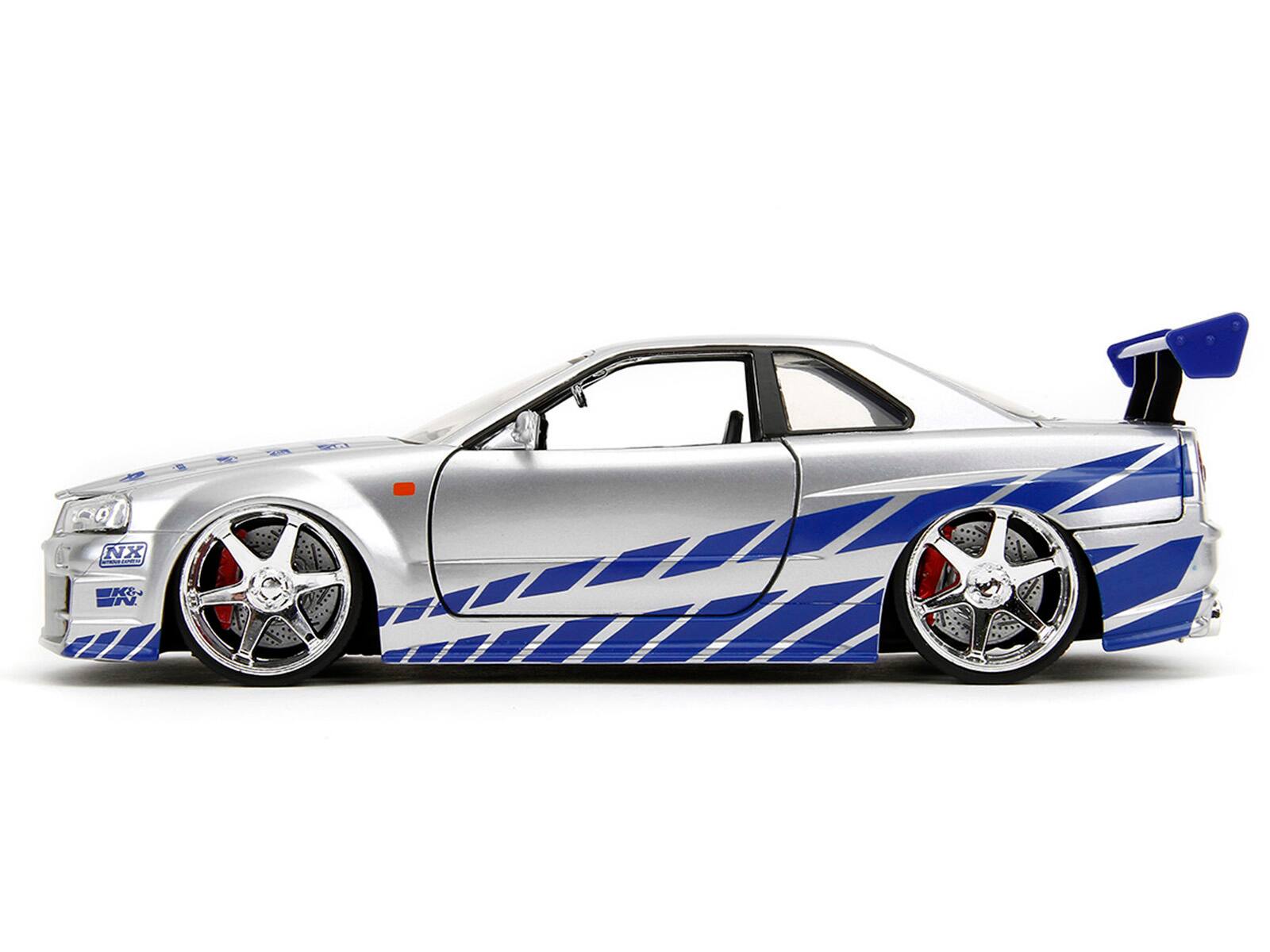 Alt View 3. Jada - Brian's Nissan Skyline GT-R (R34) Silver Metallic w/Blue & Suki's Honda S2000 Pink with Graphics 1/24 Model Cars by Jada.