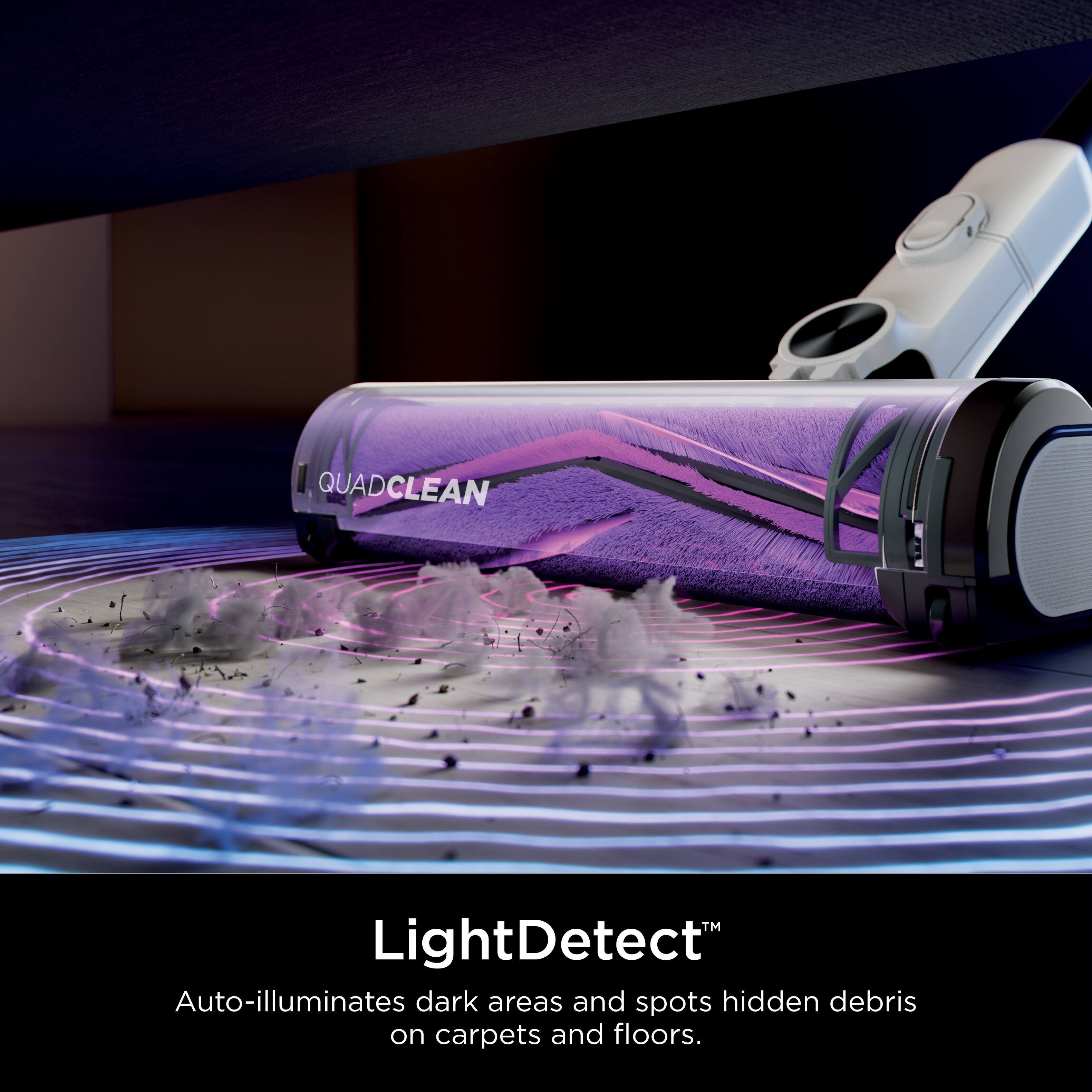 The text on the image reads: "QUADCLEAN LightDetect Auto-illuminates dark areas and spots hidden debris on carpets and floors."