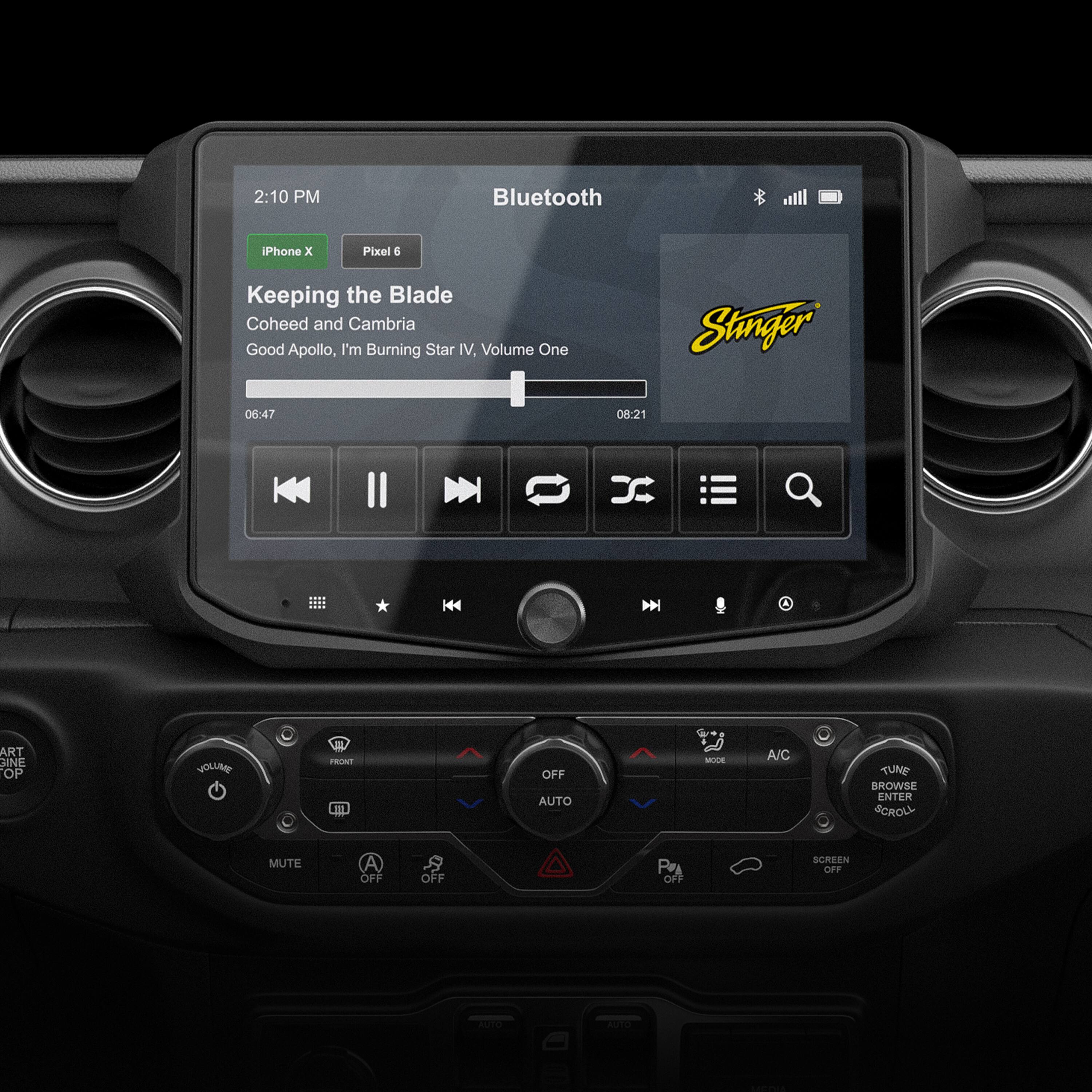 The image shows a car's dashboard with a Bluetooth device connected to it. The time displayed is 2:10 PM. The car's radio is playing music by Coheed and Cambria, specifically the song "Keeping the Blade." The volume is set to 1, and the album is "Good Apollo, I'm Burning Star IV. Volume One." The car's clock is also visible on the dashboard.