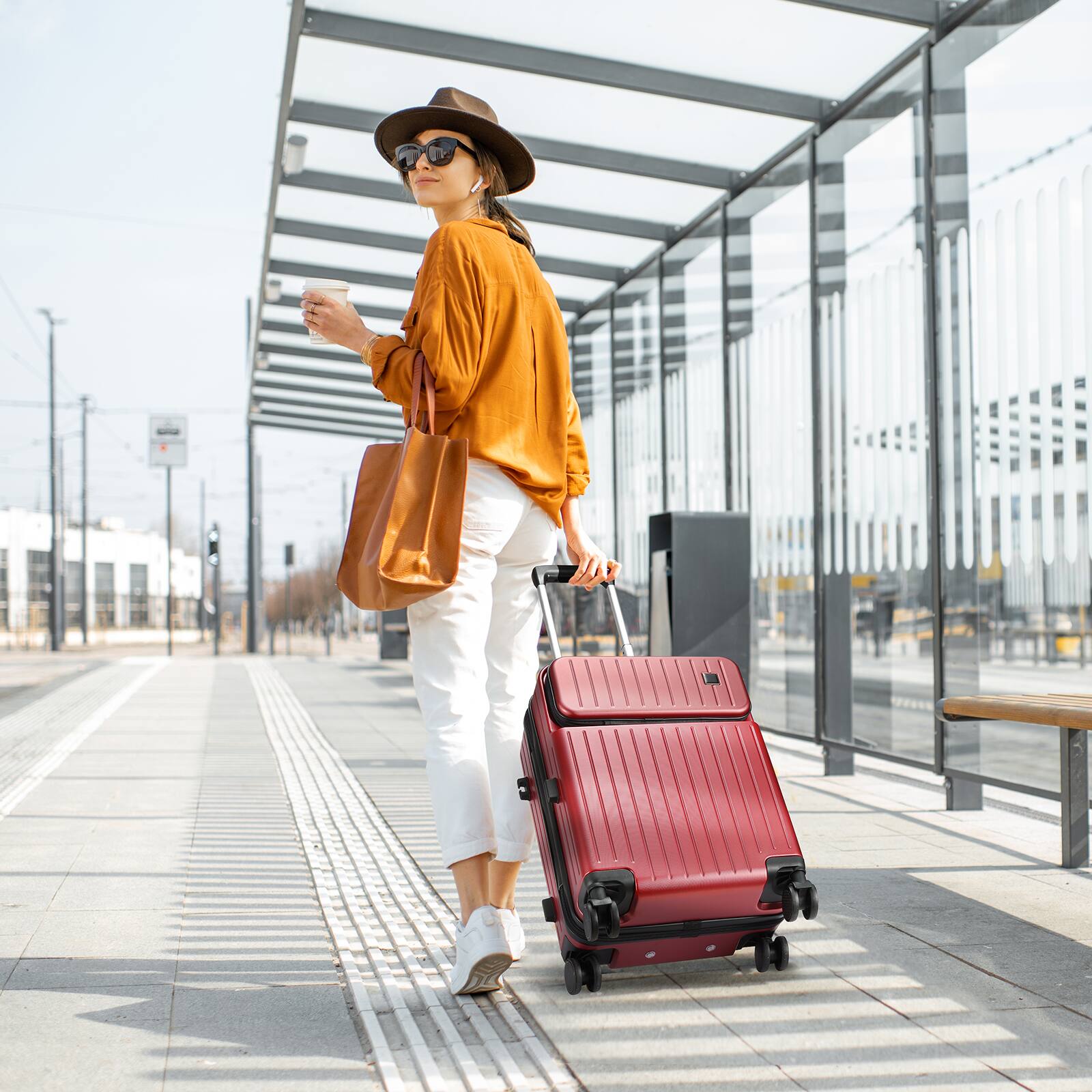 Angle. Sugift - Modern 20″ Carry-On Luggage with Front Pocket, TSA Lock, Spinner Wheels, and Organized Interior - Red.