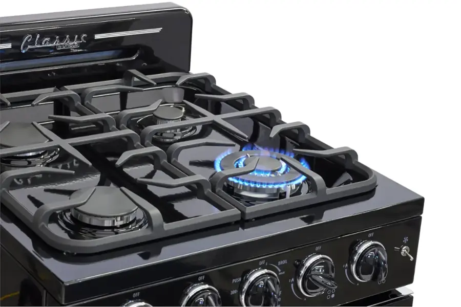 Classic 6 burner stove with 3 burners on top and 3 on the bottom. The burners are turned off, and the oven is off. The stove has a blue flame on one of the burners.