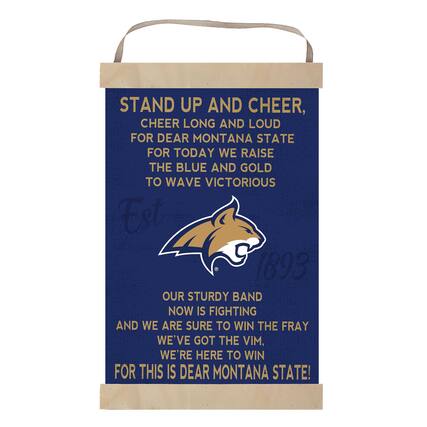STAND UP AND CHEER,
CHEER LONG AND LOUD
FOR DEAR MONTANA STATE
FOR TODAY WE RAISE
THE BLUE AND GOLD
TO WAVE VICTORIOUS
Est 1893
OUR STURDY BAND
NOW IS FIGHTING
AND WE ARE SURE TO WIN THE FRAY
WE'VE GOT THE VIM,
WE'RE HERE TO WIN
FOR THIS IS DEAR MONTANA STATE!