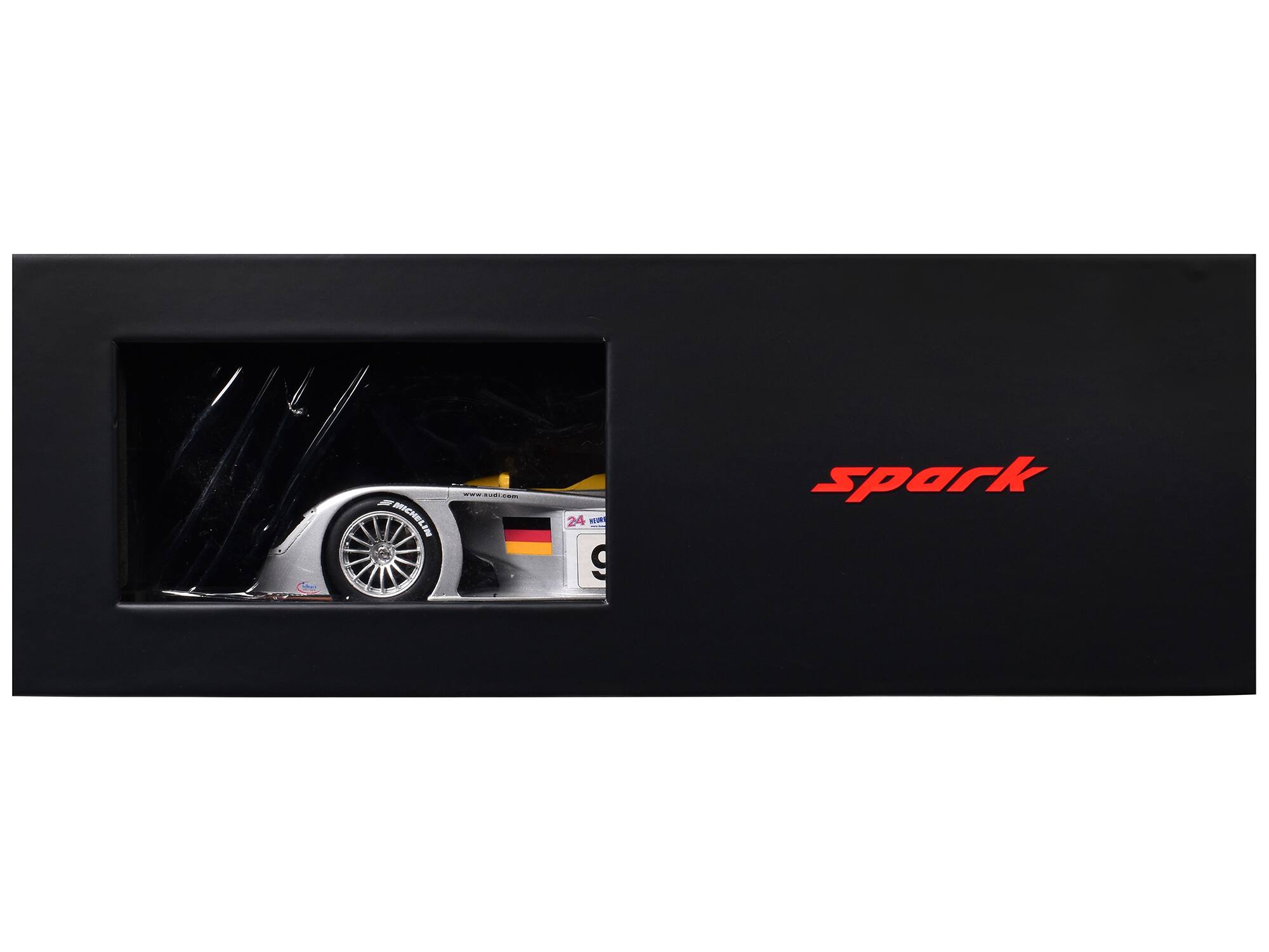 The text on the image should be grouped and corrected as follows:

- "spark" (in red, on the right side)
- "24" (on the car's number plate)
- "9" (on the car's number plate)
- "www.audi.com" (on the car's body)
- "MICHELIN" (on the tire)
- "24" (on the tire)
- "9" (on the tire)