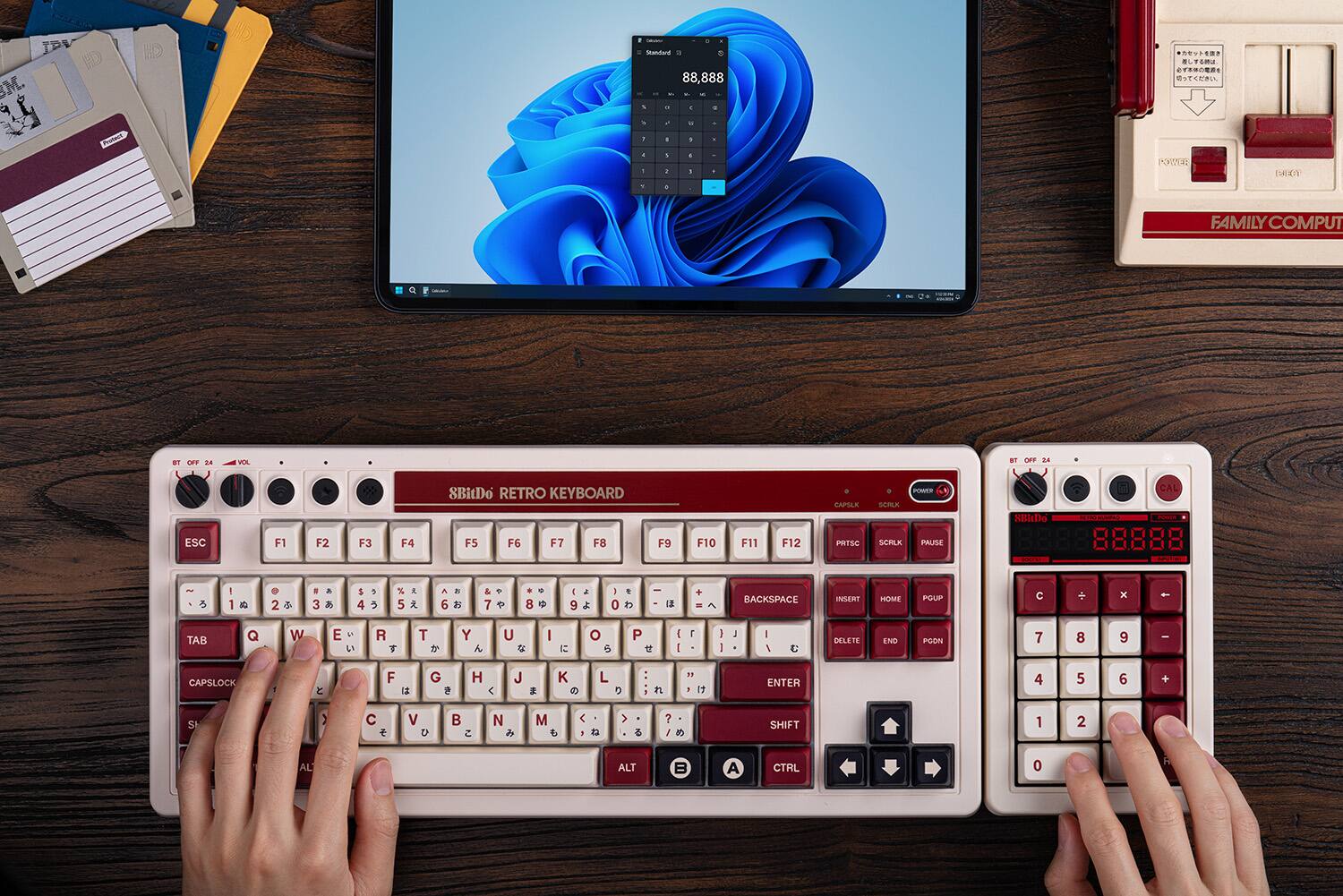 The text on the image reads: "IPA M. a8 . 88,888 - 5 - - + T.: - - - . . - 1 . . 1 - I - POTE: CALEN . FAMILY MILYCOMPUT BT OFT D I ST Dae D4 SBitDo RETRO KEYBOARD CAS SCRLK POWE s CAL ESC F1 F2 F3 F4 F5 F6 F7 F8 F9 F10 F11 F12 PRTSC SCRLK PRUSE  1 1 2 3 5 4 5 6 7 8 9 0 - E + - BACKSPACE INSERT HOME PGUP C x - TAB Q W E . R T T Y U I o 6 P I I I I I - I DELETE END PGDN 7 8 9 - CAPSLOCK  F L G e H  J  K  L  FL 1 1  ENTER 4 5 6 + S  C  V 5 N  M < I > 2 /  SHIFT 1 2 ALT 3 ACTRL 0 R ALT."