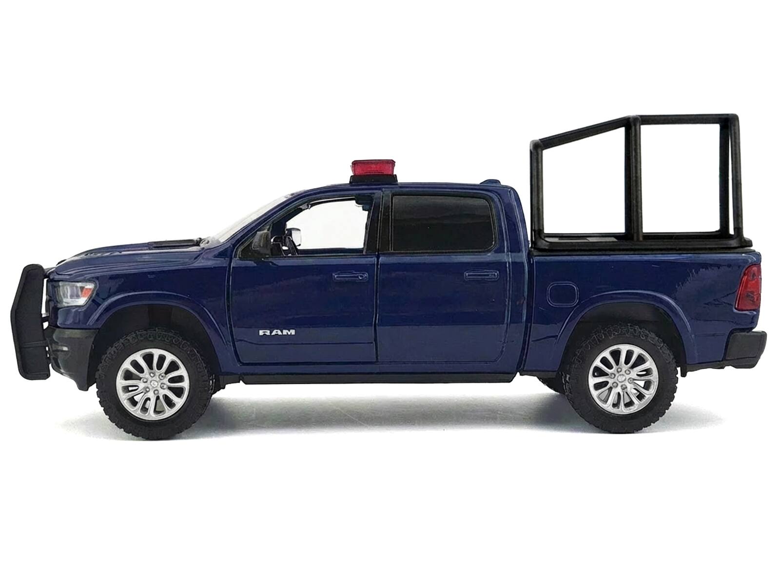 Alt View 2. Motormax - 2019 RAM 1500 Laramie Crew Cab Pickup Truck with Bed Cage Dark Blue with Lights and Sounds 1/27 Model Car by Motormax.