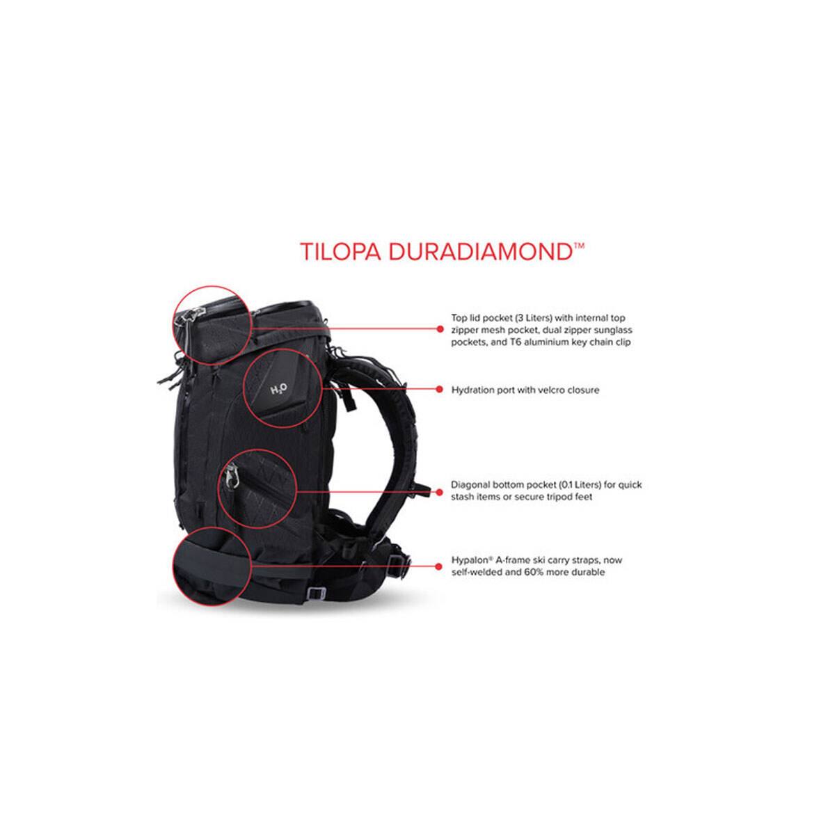 TILOPA DURADIAMOND™

Top lid pocket (3 Liters) with internal top zipper mesh pocket, dual zipper sunglass pockets, and T6 aluminium key chain clip

Hydration port with velcro closure

Diagonal bottom pocket (0.1 Liters) for quick stash items or secure tripod feet

Hypalon A-frame ski carry straps, now self-welded and 60% more durable
