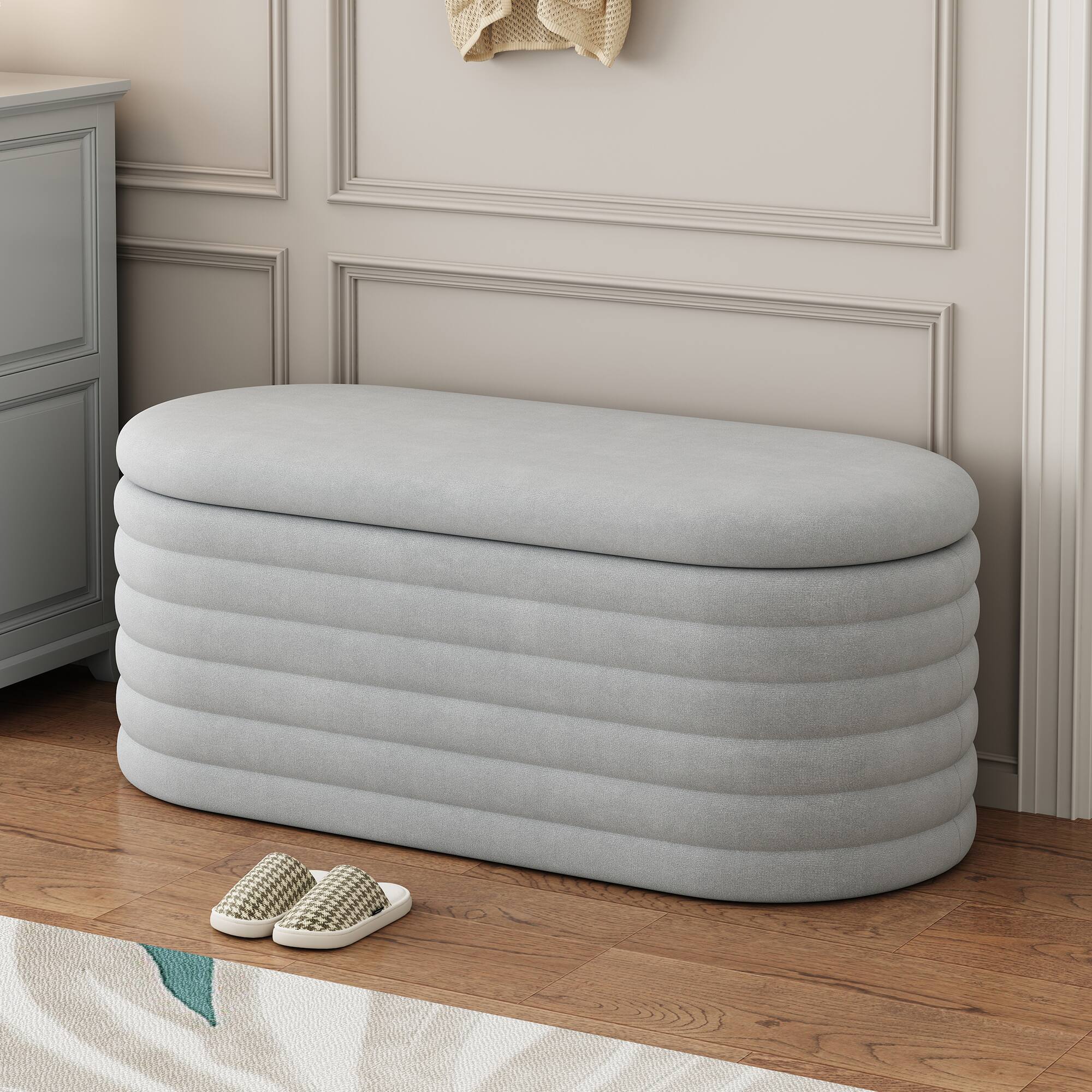 Left. GOODSILO - Upholstered Fabric Storage Ottoman Bench with Safety Hinge - Multi-Functional Footrest and Seating Solution - Light Grey.