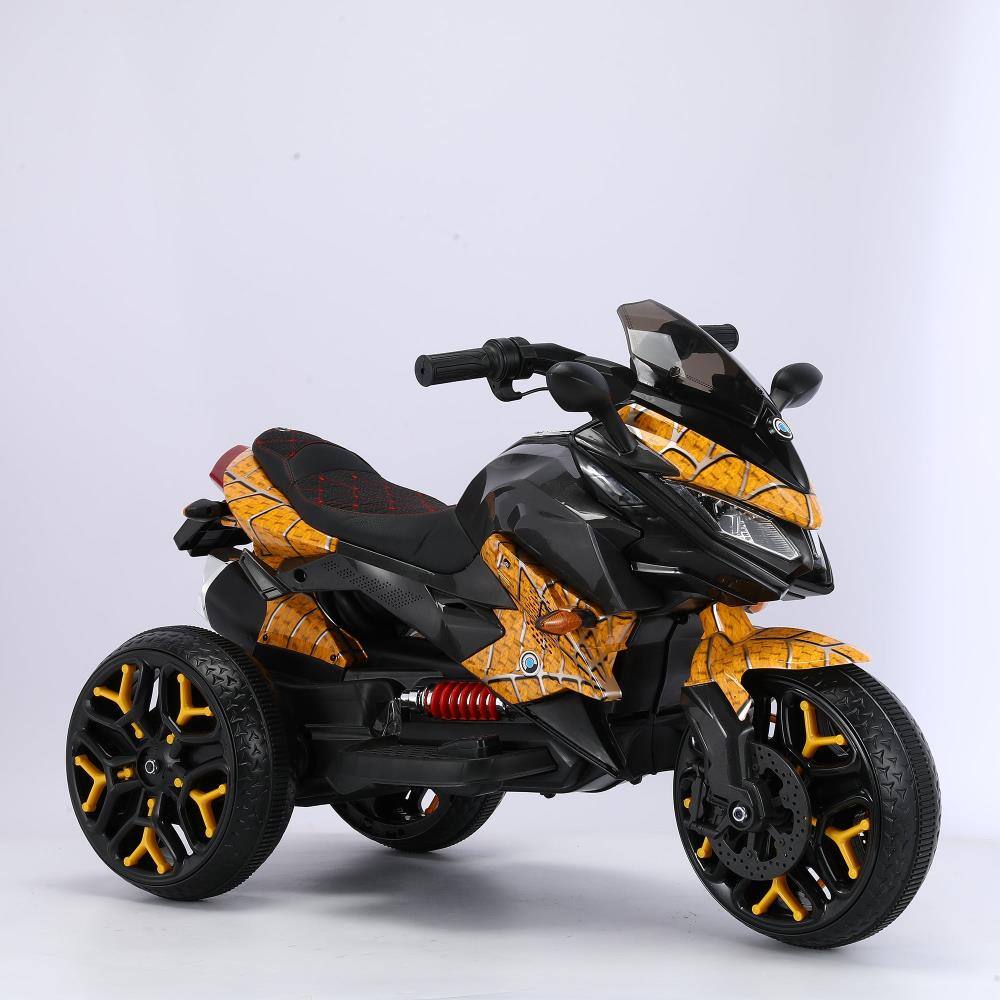 Angle. BreeBe - 12V Kids Ride On Motorcycle, 3-Wheel Battery Powered Motorbike with PU Seat, Training Wheels, Manual Throttle & Lights - Yellow.
