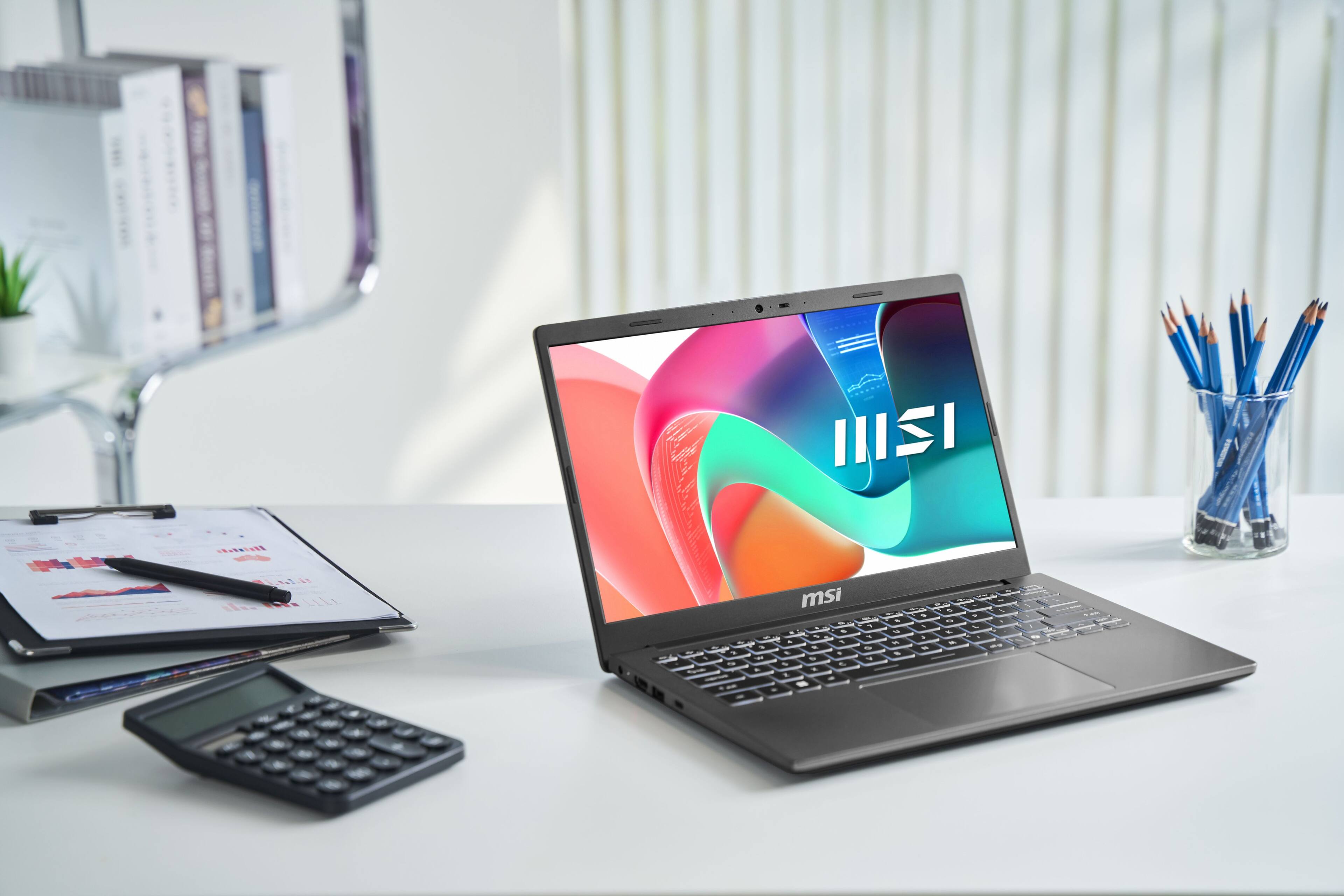 ISI is displayed on the laptop screen.