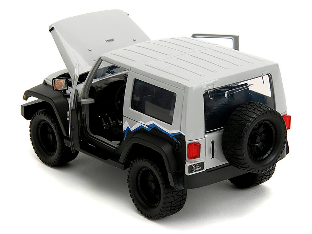 Left. Jada - 2007 Jeep Wrangler Gray and Black with Blue and White Stripes with Extra Wheels "Just Trucks" Series 1/24 - Gray and Black.