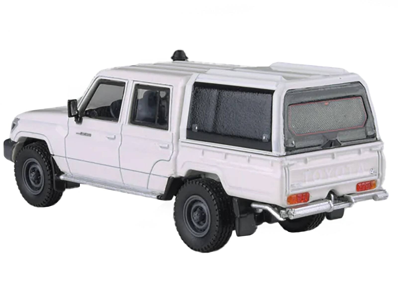 Angle. Paragon - 2012 Toyota Land Cruiser LC 79 French Vanilla White with Canopy 1/64 Diecast Model Car by Paragon Models - White.