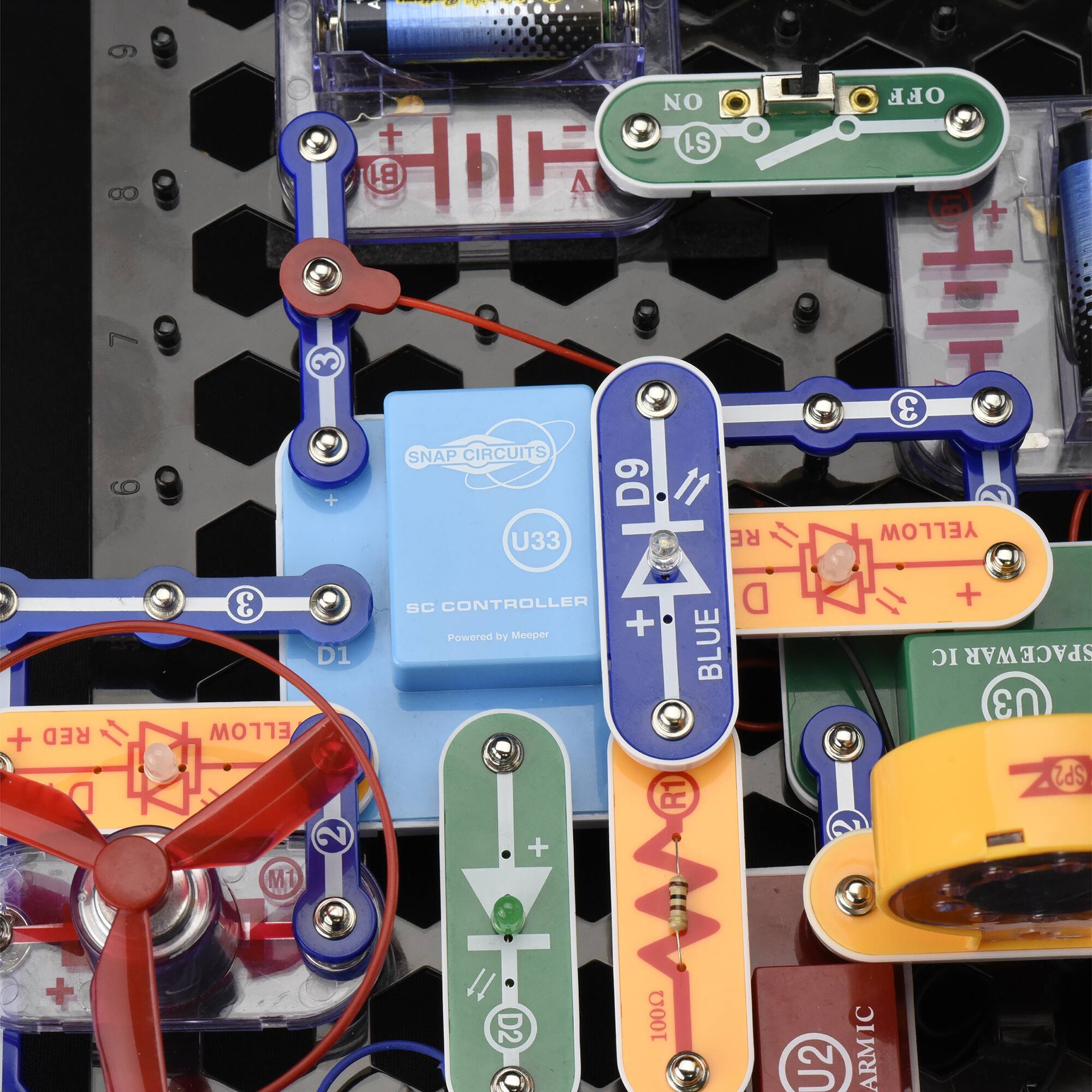 The text on the image is grouped and corrected as follows:

* I  NO + S1 B1 H SNAP CIRCUITS + D9 11 U33 RE OFF + H 3 YELLOW + RED 3 D1 ELLOW 2 M1 SC CONTROLLER D by Meeper + Powered BLUE R1 + S + IC SPACEWAR U3 SP2 + D2 100 IC U2 ARMI

The corrected text is a combination of various electronic components and their functions, such as the Snap Circuits, the controller, and the powered Blue component. The text also includes the names of the colors used in the image, such as Yellow and Red.