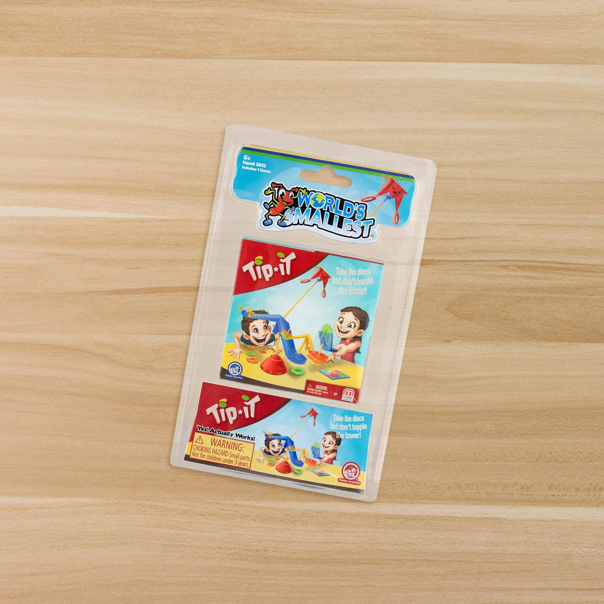 B - seE -  SMALLEST. WORLD'S Tip-iT but Tabe don' te topple dioos the lower!  Tip-iT PeE A Actually A Works! CHOKING WARNING: Not fr children HAZARD-SI Smal pets ander 1  par  - S - 41 Tale te dect but don' t lopple be lower! d

Corrected text:

B - seE -  SMALLEST. WORLD'S Tip-iT but Tabe don't topple the lower!  Tip-iT PeE A Actually Works! CHOKING WARNING: Not for children under 3 years. HAZARD-Small parts.