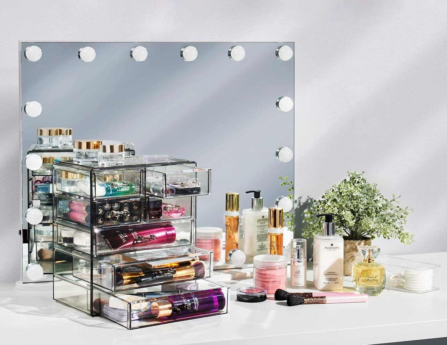 The text in the image appears to be:

- "PRopeS's ell" (likely a misspelling or partial text, not fully visible)
- "PICKNEY'S"
- "GARDENIA"
- "Eau de Parfum"
- "REVITAL"
- "L'Oréal"
- "Lancôme"
- "Dior"
- "Chanel"
- "Yves Saint Laurent"
- "Guerlain"
- "Dior"
- "Chanel"
- "Lancôme"
- "Yves Saint Laurent"
- "Guerlain"
- "Dior"
- "Chanel"
- "Lancôme"
- "Yves Saint Laurent"
- "Guerlain"
- "Dior"
- "Chanel"
- "Lancôme"
- "Yves Saint Laurent"
- "Guerlain"
- "Dior"
- "Chanel"
- "Lancôme"
- "Yves Saint Laurent"
- "Guerlain"
- "Dior"
- "Chanel"
- "Lancôme"
- "Yves Saint Laurent"
- "Guerlain"
- "Dior"
- "Chanel"
- "Lancôme"
