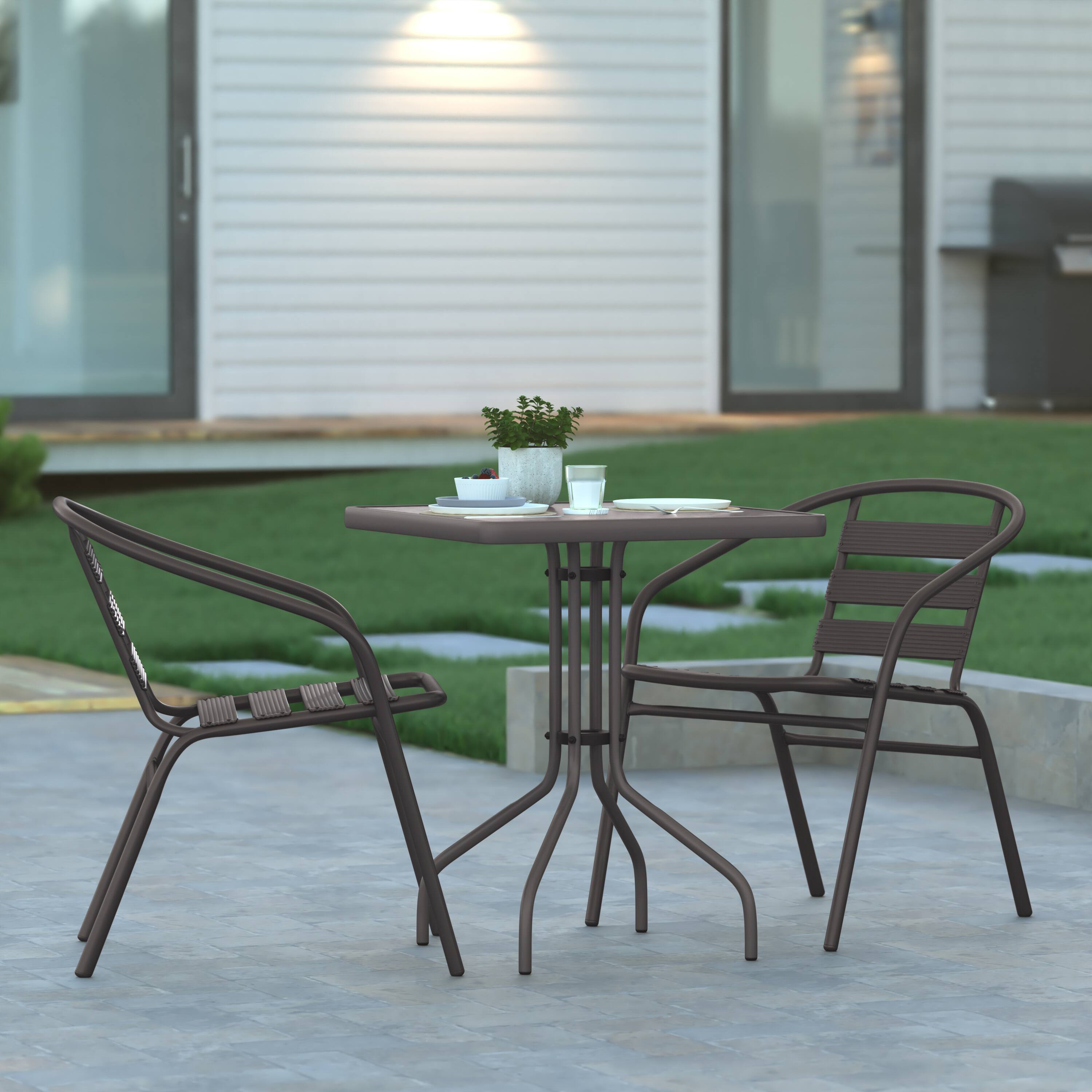 Alt View 1. Emma + Oliver - Rhea 23.5'' Square Glass Top Metal Table with 2 Aluminum Slat Stack Chairs - Bronze.