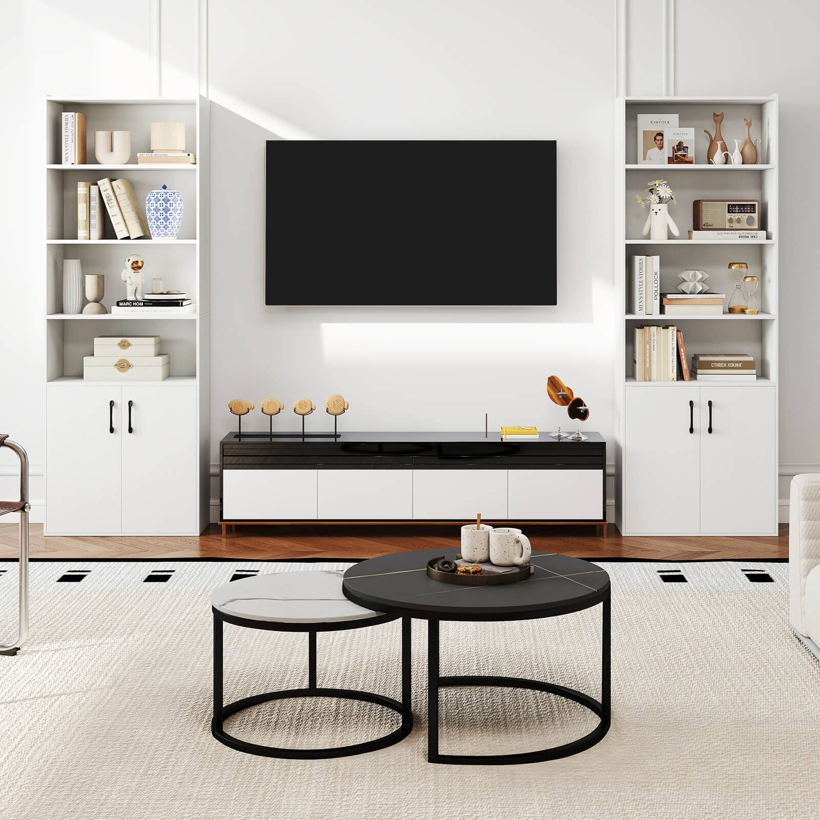 The image shows a living room with a large flat screen TV mounted on the wall. The room is decorated with a black coffee table, a rug, and a bookshelf. The bookshelf is filled with various books, and there is a vase on the table. The living room also features a couch and a chair, creating a comfortable and inviting space for relaxation and entertainment.