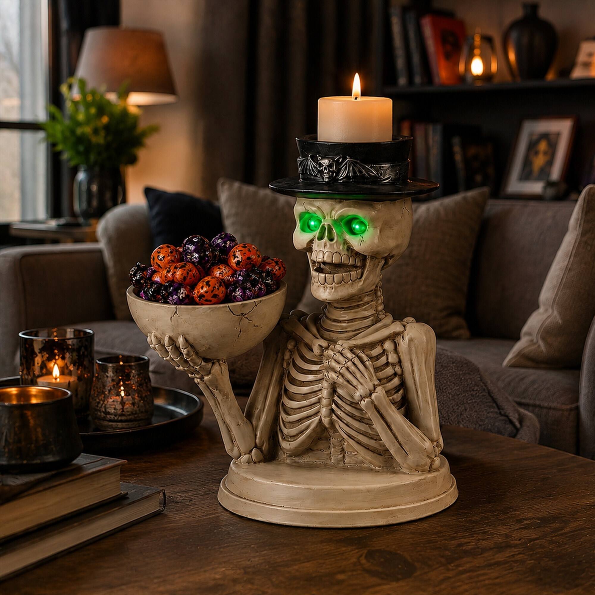 Angle. RYHNUYNE - Spooky Halloween Skeleton Figurine with LED Glowing Eyes, Candy Bowl and Candle Holder for Indoor Home Decor - White.