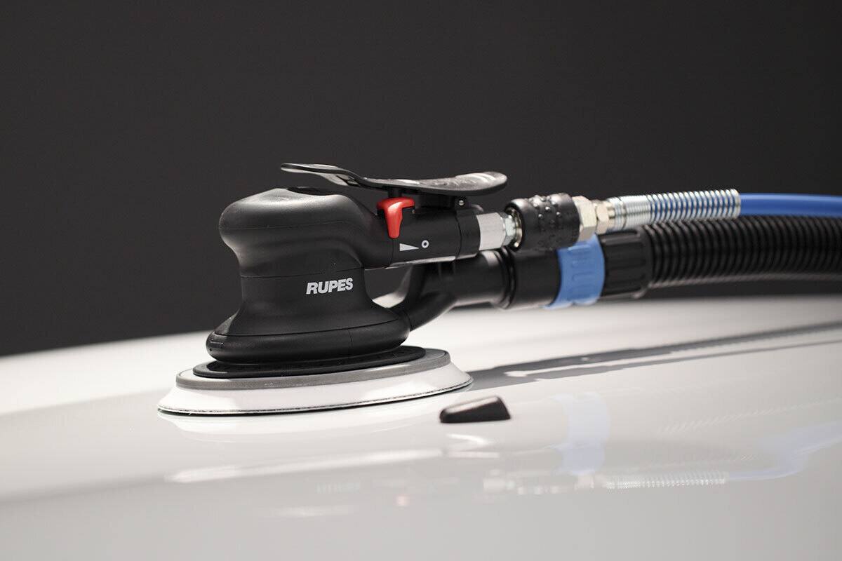 Left. RUPES - Rupes Skorpio III Random Orbital Palm Pneumatic Sander with Central Vacuum.