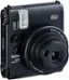 The text on the image reads "INSTAX MINI 99 : 1 1 0.3m-1 RANGE FOCUS INSTAX LENS 60mm".