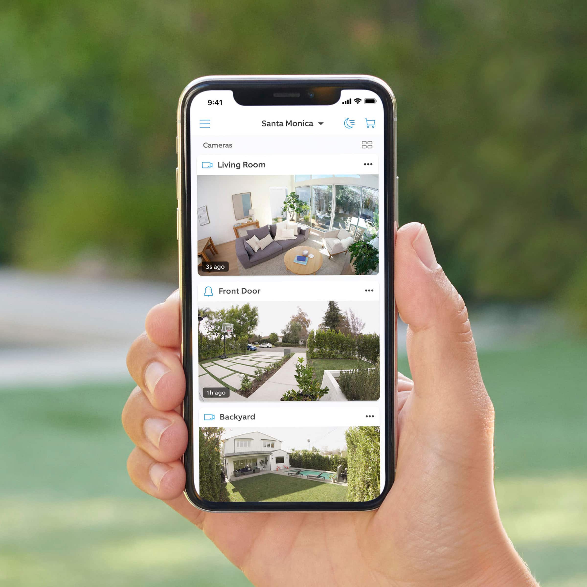 The text on the image is: "9:41 in Santa Monica Cameras DO - Living Room - at ago Front Door - 1h ago Backyard."