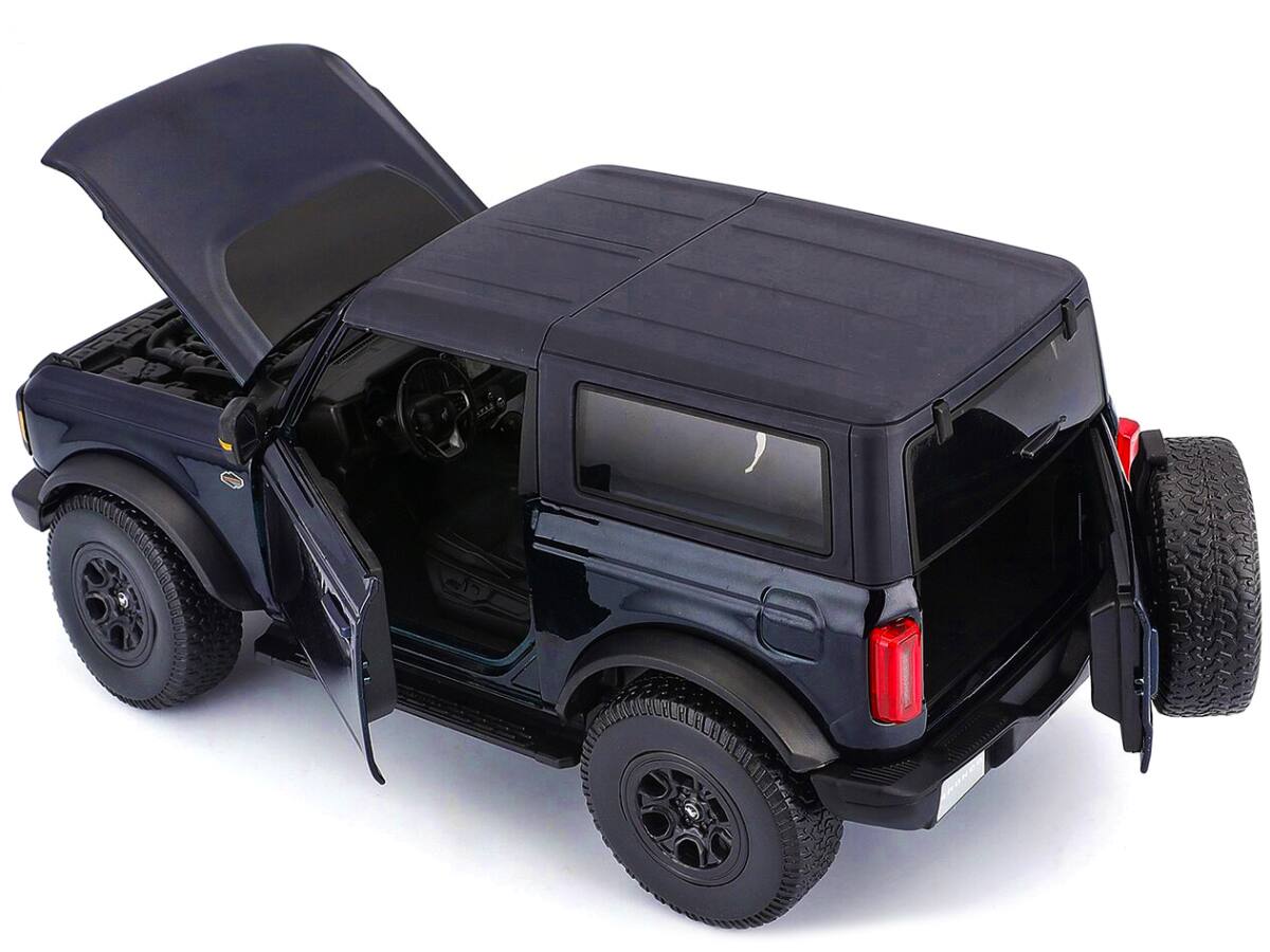 Alt View 2. Maisto - 2021 Ford Bronco Wildtrak Dark Blue Metallic with Dark Gray Top "Special Edition" 1/18 Diecast Model Car by Maisto.