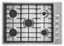 The image features a white stove top with black burners. The burners are arranged in a circular pattern, with four burners on the left side and four on the right side. The stove top is clean and ready for use.