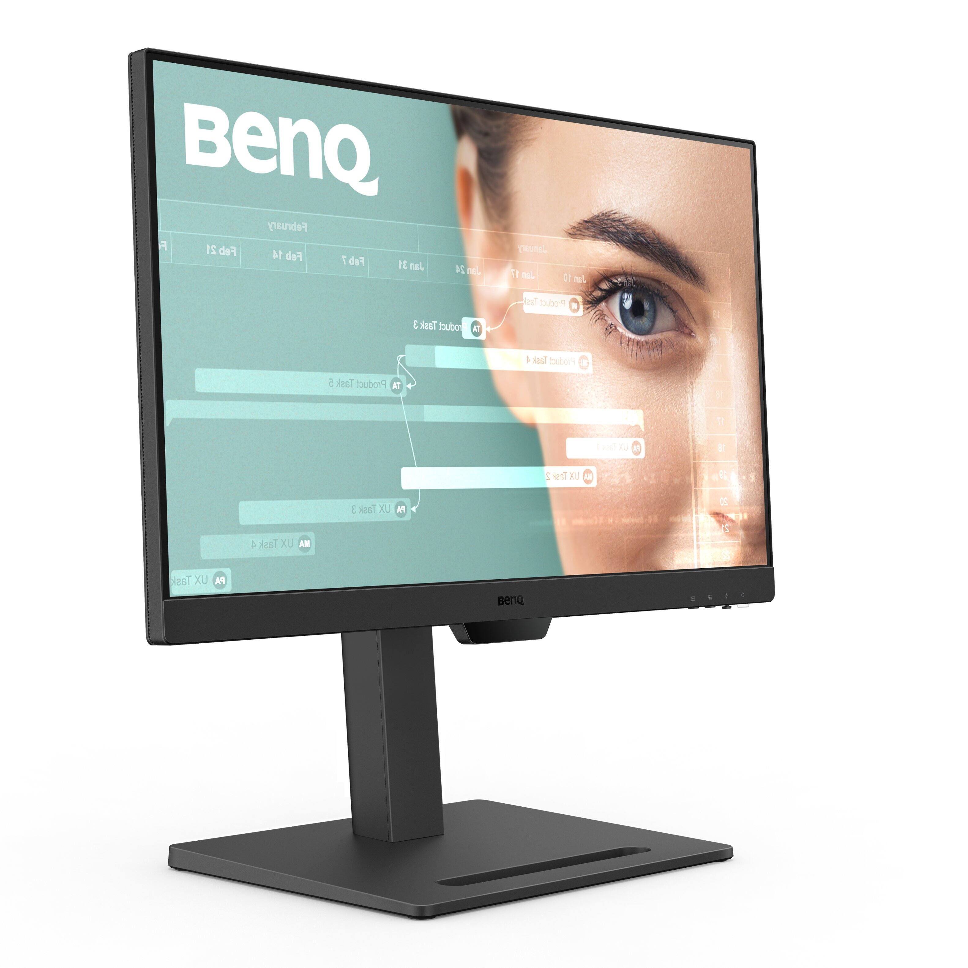 BenQ is a company that manufactures computer monitors and other electronic devices. The image shows a BenQ computer monitor with a woman's face displayed on the screen. The monitor is placed on a stand, and it is a flat screen model. The company's name, BenQ, is displayed at the top of the monitor.