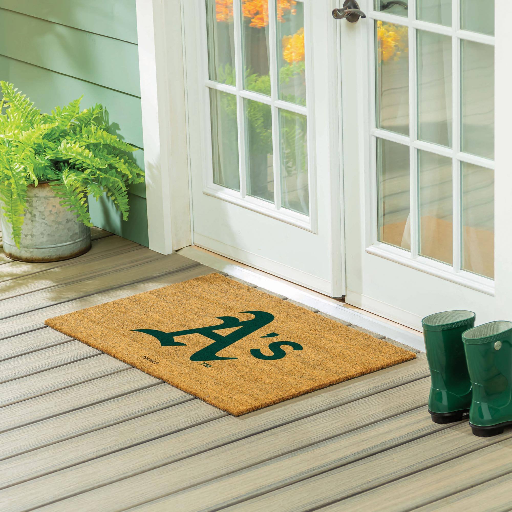 The text on the doormat reads: "A's"