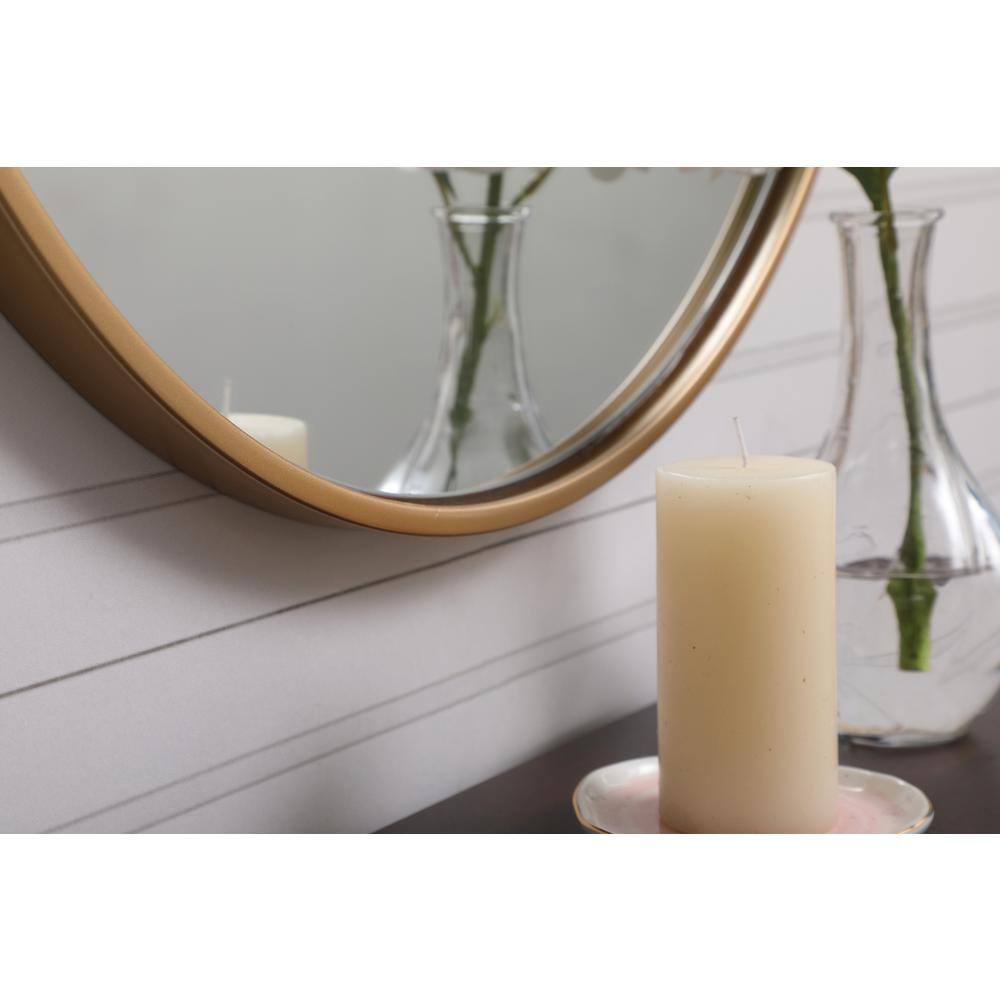 Left. Elegant Decor - Metal frame round mirror with decorative hook 21 inch in Brass - Brass.