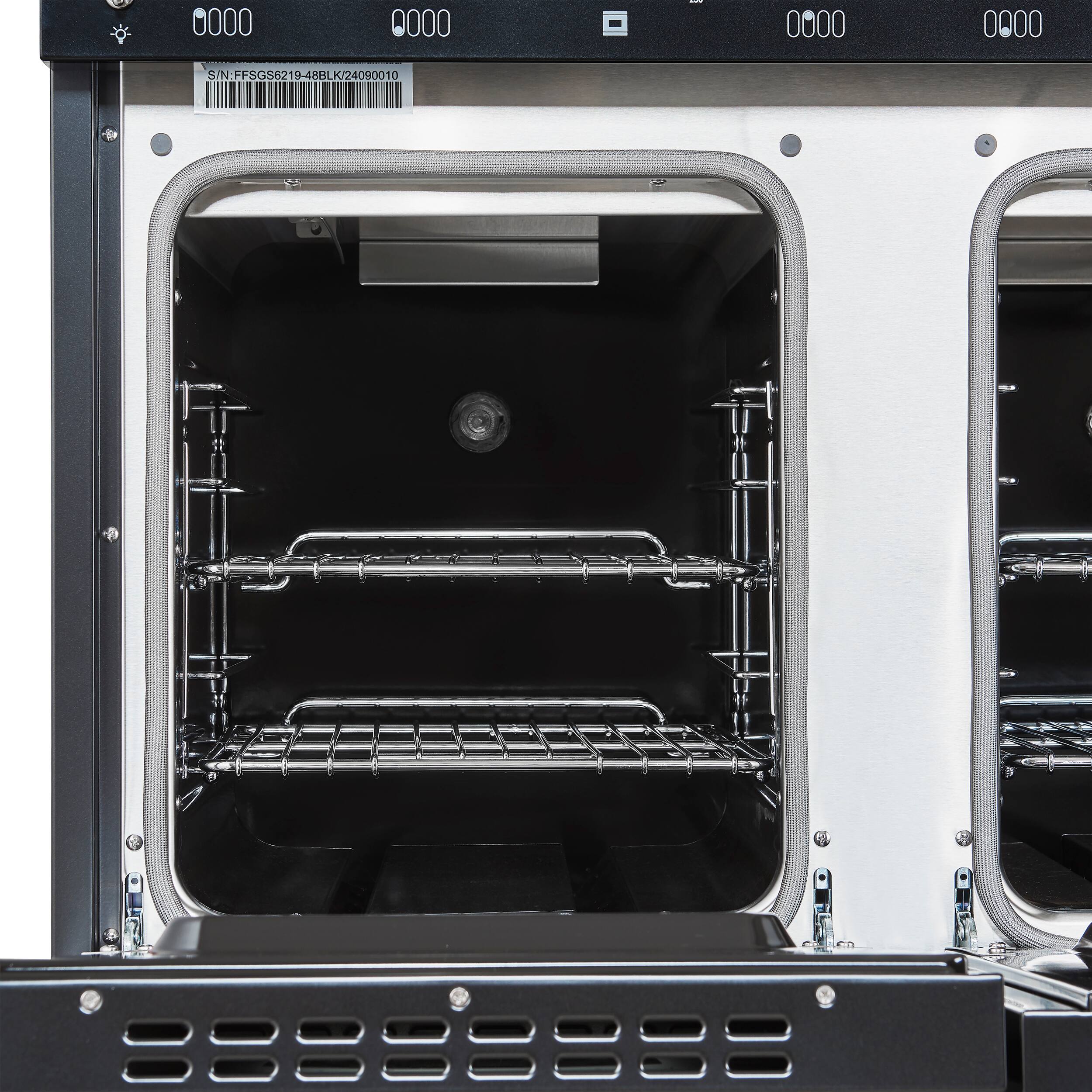 The image shows two ovens with their doors open. The ovens are white and black in color. The first oven has a black door, while the second oven has a white door. The ovens are placed next to each other, and they appear to be empty. The image also includes a barcode, which is likely a part of the oven's identification or labeling system.