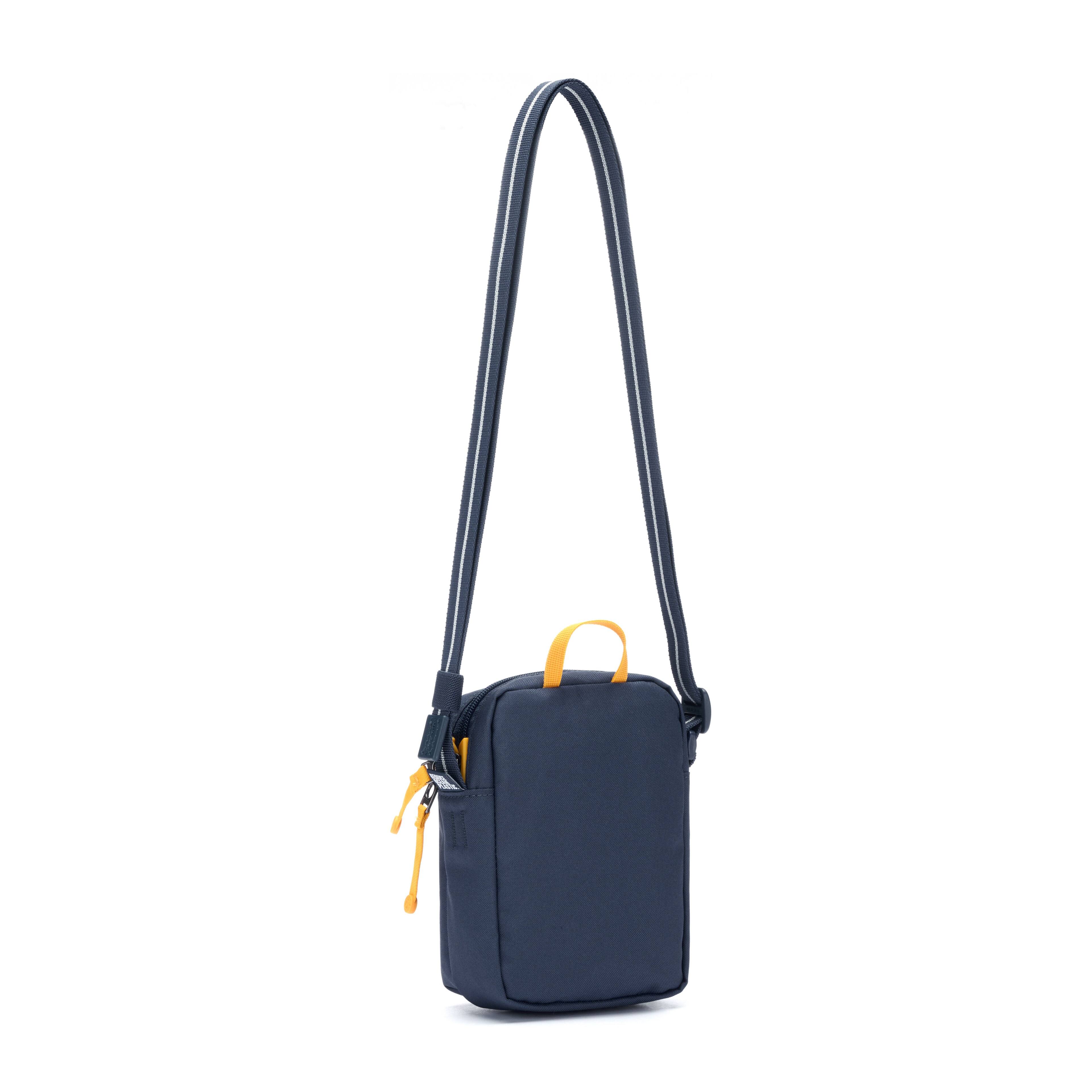 Left. Pacsafe - GO Micro Crossbody (Coastal Blue) - Coastal Blue.