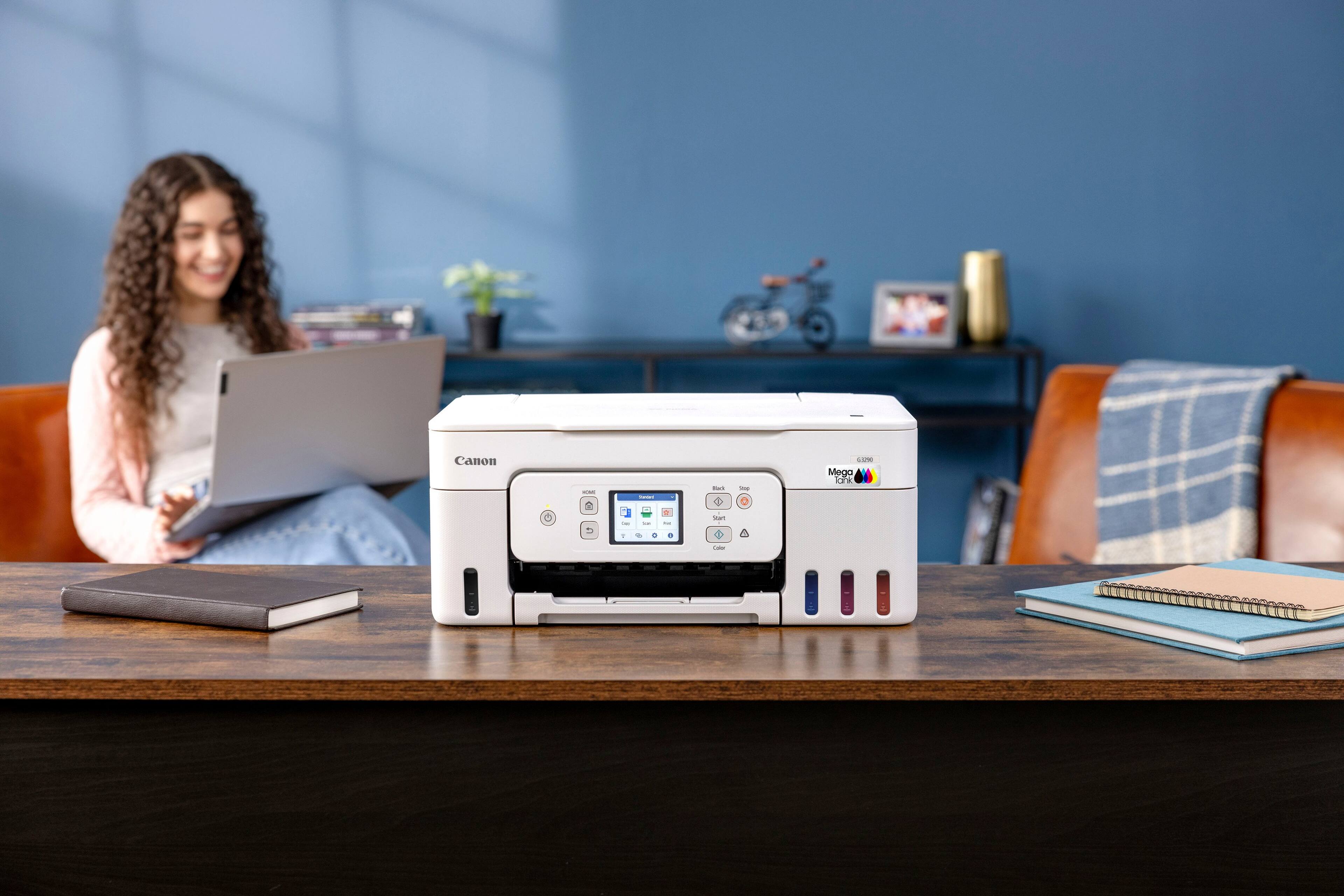 Canon printer on a desk.