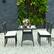Alt View 3. Costway - 5PCS Patio Rattan Dining Set Cushioned Chair Table w/Glass Top Garden Furniture - Black,White.