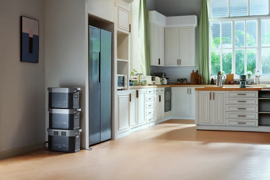 The image shows a kitchen with a refrigerator, a sink, and a microwave. The refrigerator is located on the left side of the kitchen, while the sink is situated in the middle. The microwave is positioned on the right side of the kitchen. The kitchen also features a window, which allows natural light to enter the space. The overall layout of the kitchen appears to be functional and well-organized.
