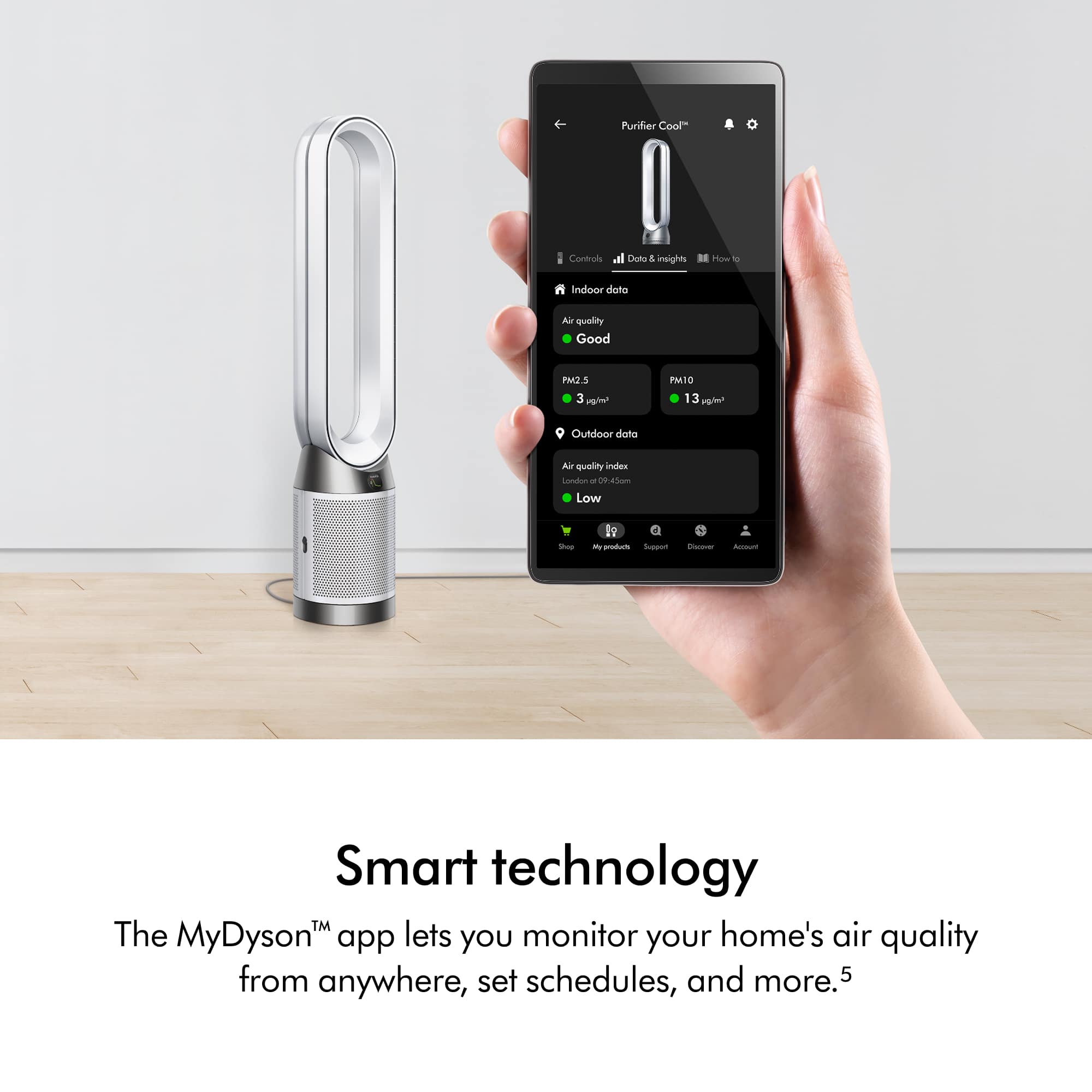 The image features a person holding a smartphone, which is displaying information about an air purifier. The phone is being used to control the air purifier, which is placed nearby. The text on the image highlights the benefits of using smart technology, such as the MyDyson app, to monitor air quality and set schedules for the air purifier. This allows for better control over indoor air quality and improved overall comfort in the home.