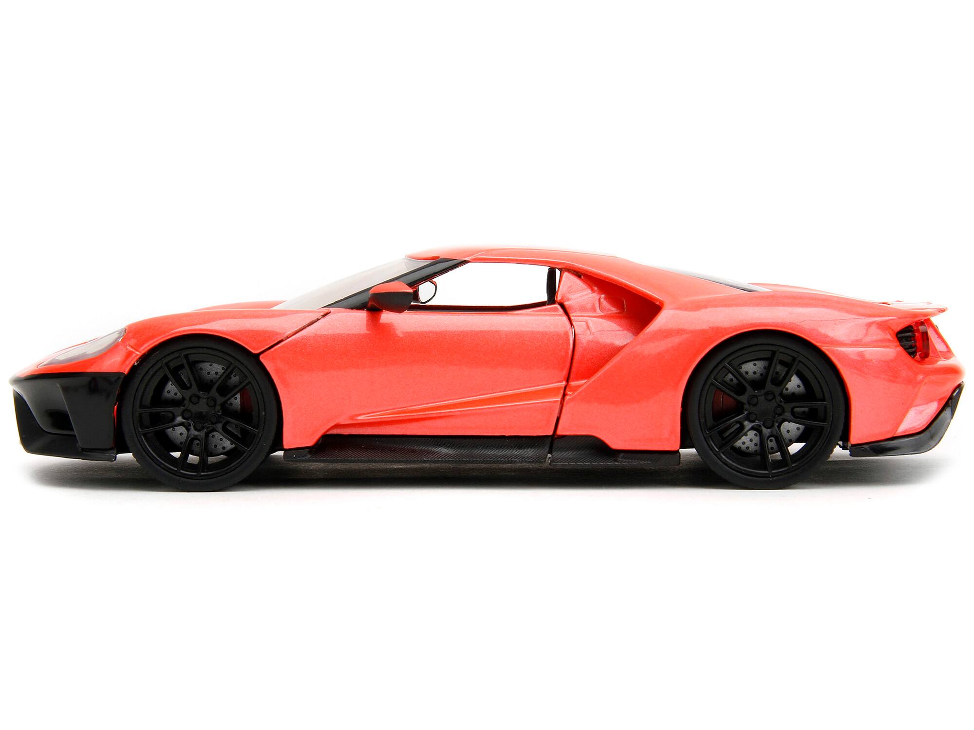 Left. Jada - 2017 Ford GT Light Red Metallic with Black Stripe "Pink Slips" Series 1/24 Diecast Model Car by Jada - Light Red Metallic With Black.