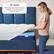 The text on the image states that the 19" depth washable cover holds the topper in place and fits mattresses up to 19" deep. This suggests that the mattress is designed to provide a comfortable sleeping experience with a washable cover that can accommodate a topper for added support and comfort.