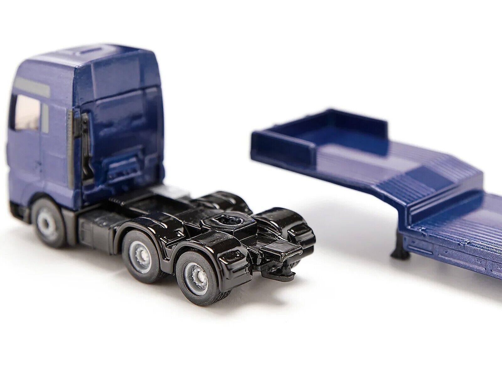 Left. SIKU - MAN Truck Blue Metallic with Low Loader Trailer and JCB 457 Wheel Loader Yellow 1/87 (HO) Diecast Model by Siku - Blue Metallic.