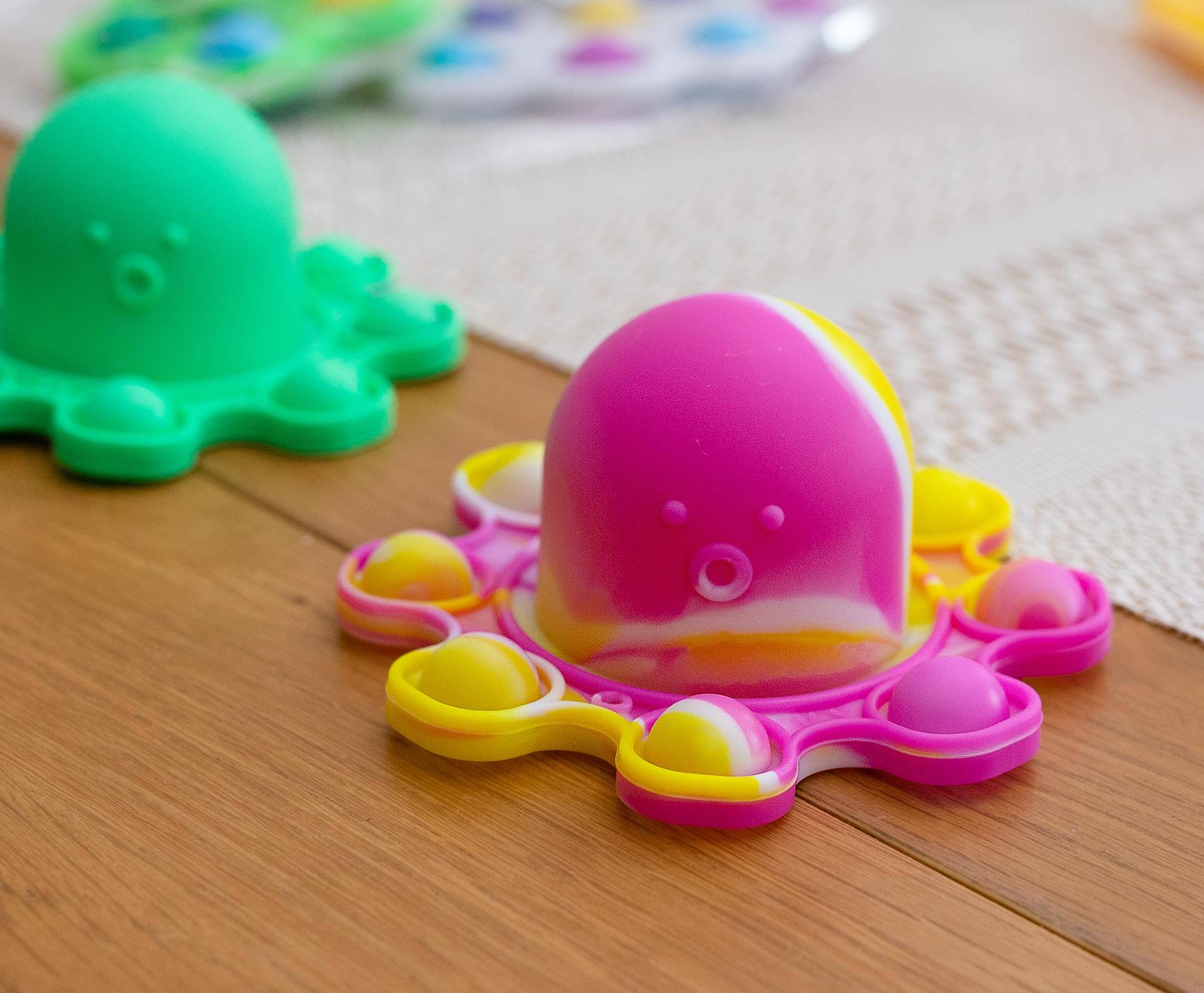 Alt View 10. Toynk - Pop Fidget Toy Yellow & Pink Octopus 8-Button Silicone Bubble Popping Game - Yellow.