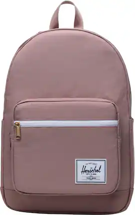The Herschel Supply Co. brand is known for its fine quality products. The image features a backpack with a pink color, which is a popular choice among customers. The backpack is designed with a strap and a zipper, making it convenient and functional for daily use. The Herschel Supply Co. brand is known for its durability and style, making it a popular choice for those looking for a reliable and fashionable backpack.