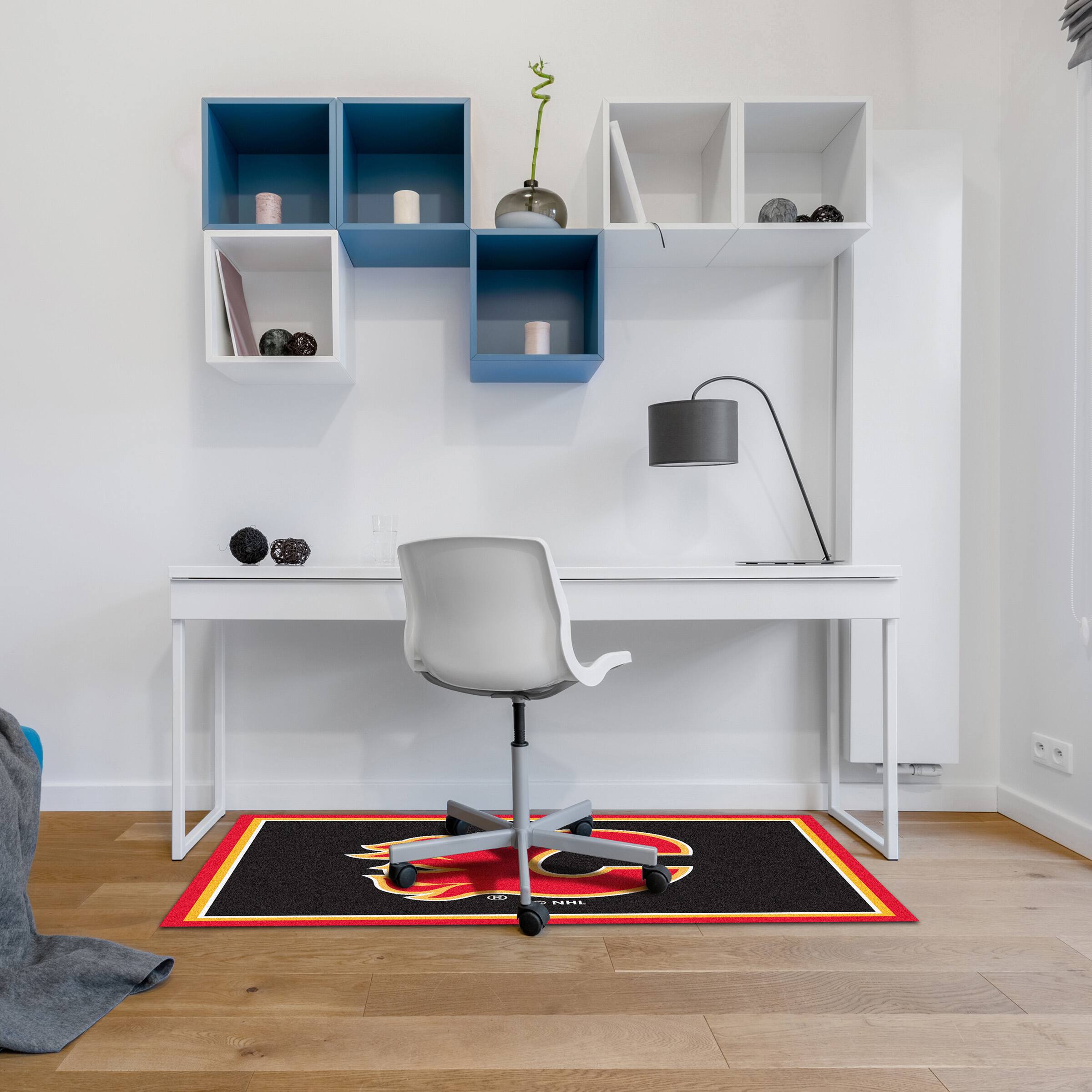 The image does not contain any text to group or correct. It shows a modern home office setup with a desk, chair, shelves, and a rug.