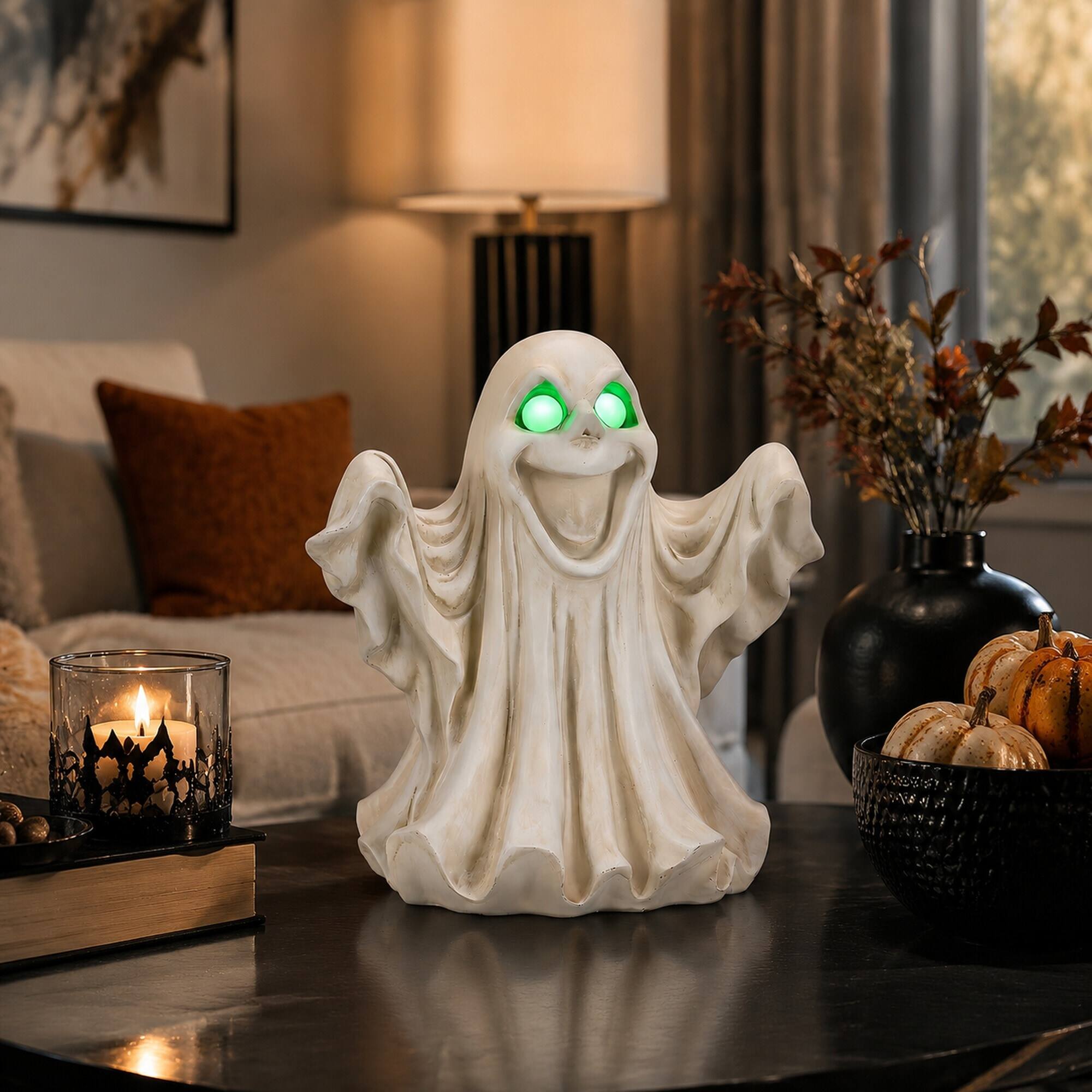 Angle. RYHNUYNE - Halloween Ghost Figurine with Glowing LED Eyes for Spooky Home and Party Decor, Resin Tabletop Statue for Shelves - White.