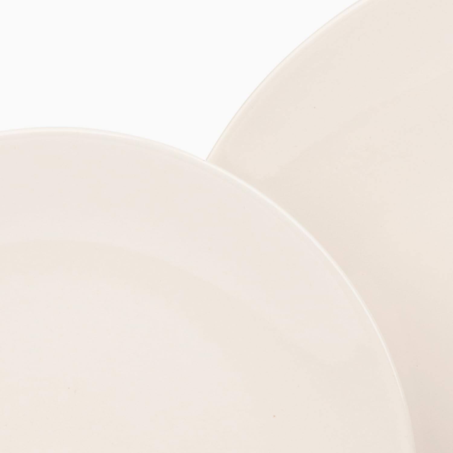 Angle. Larder & Vine - 16-Piece Classic Dinnerware Set for 4, Ceramic Stoneware Made in Portugal - Natural White.