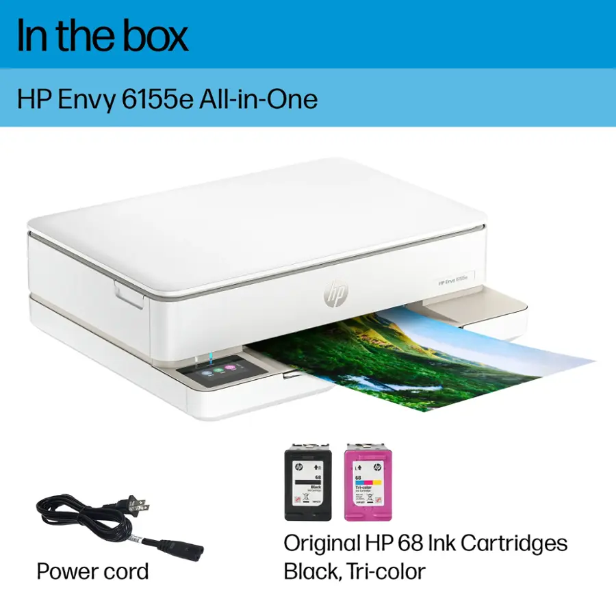 In the box, there is an HP Envy 6155e All-in-One printer. The printer comes with a power cord and Original HP 68 Ink Cartridges in Black, Tri-color.