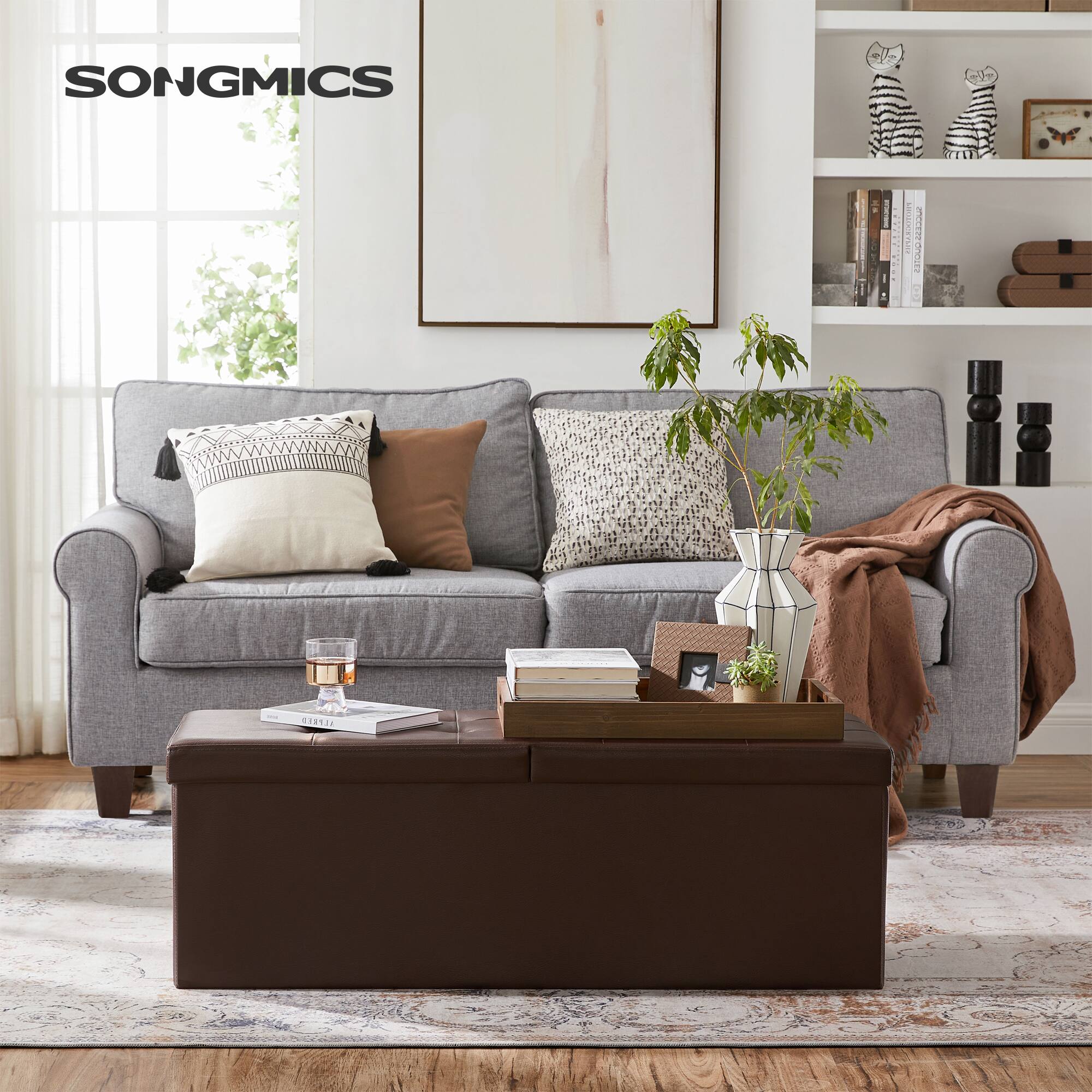 Angle. Songmics Home - 43 Inches Folding Storage Ottoman Bench with Flipping Lid, Storage Chest Footrest Padded Seat with Iron Frame Support - Brown.