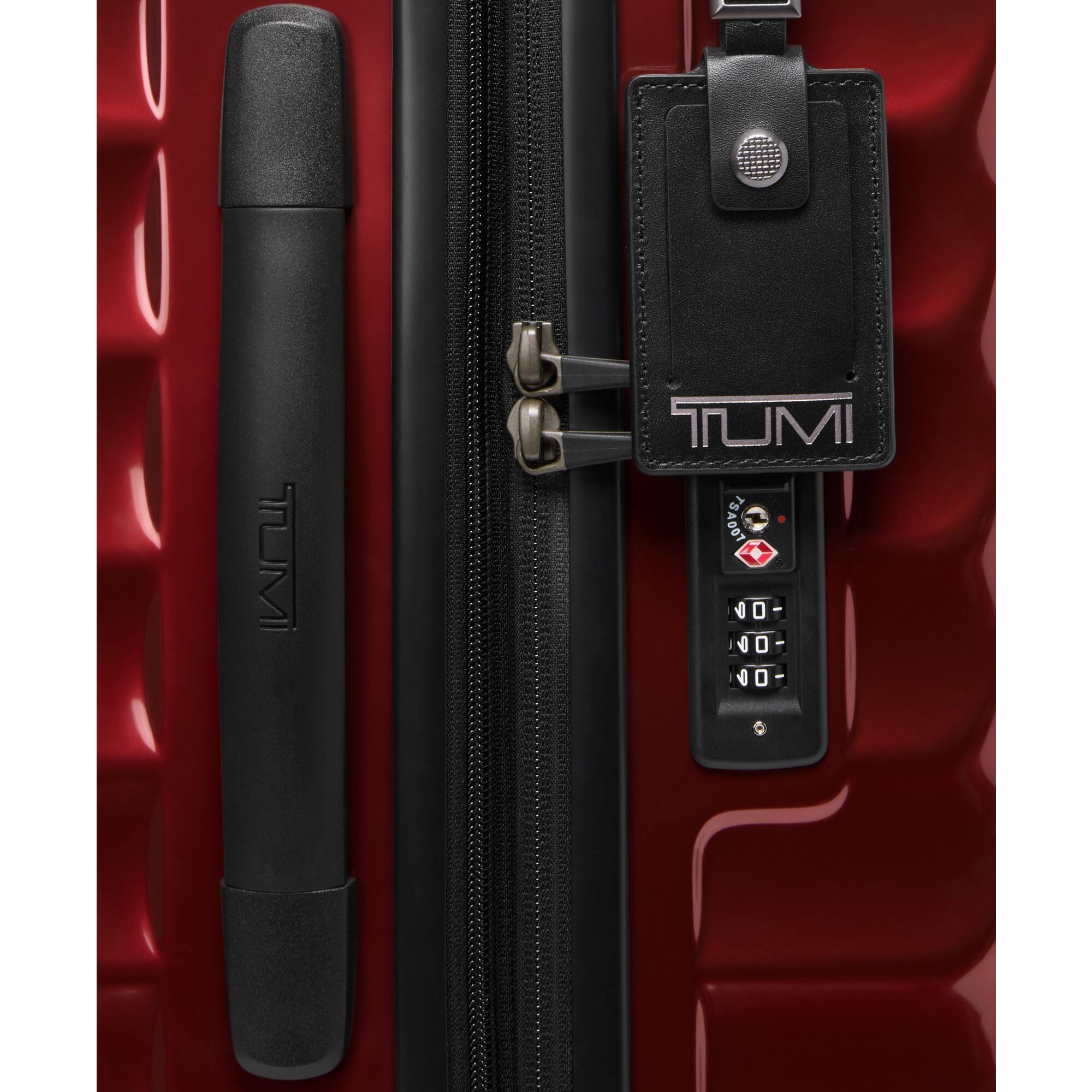 The text on the image is "TUMI TSA007".