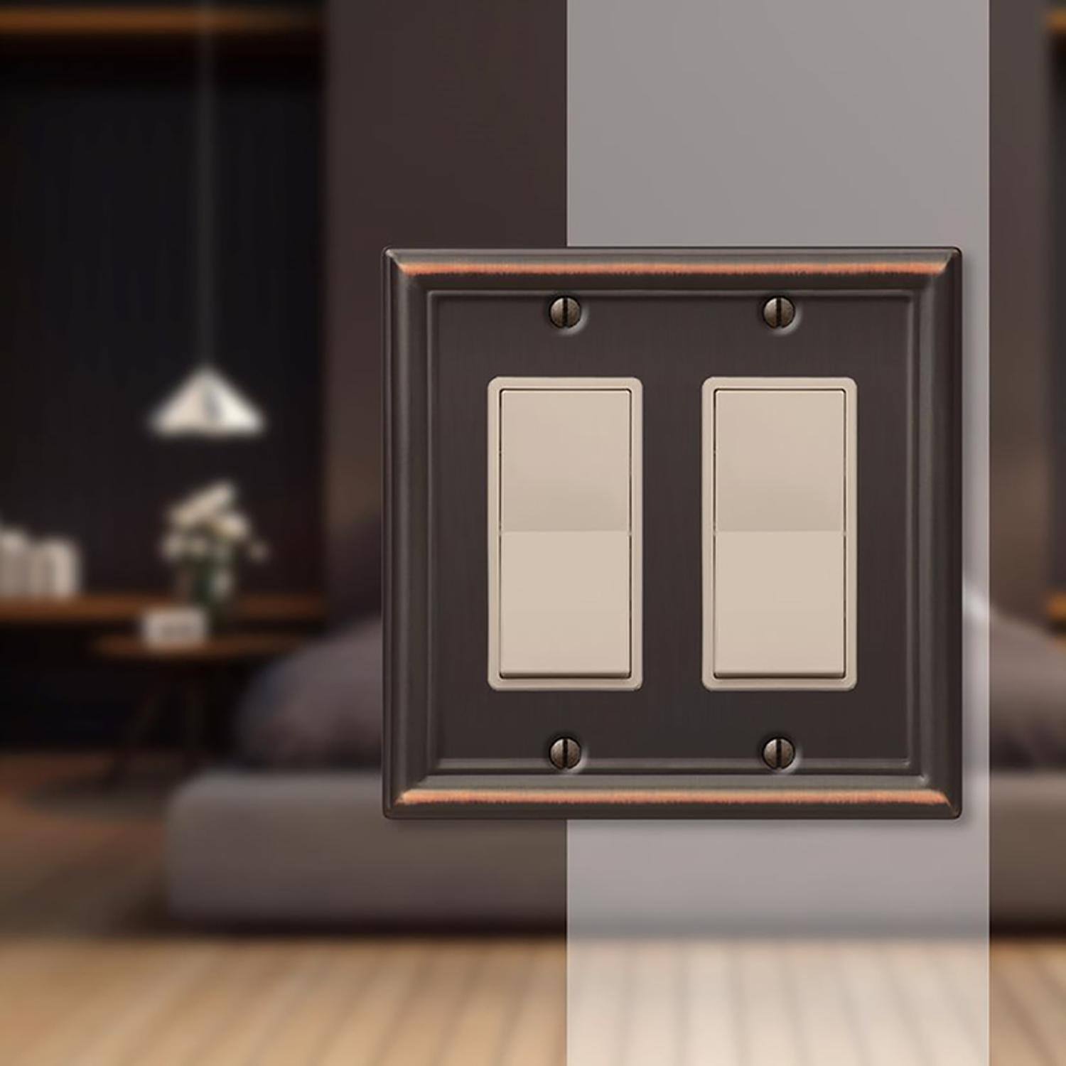 Left. AMERELLE - Amerelle Chelsea Aged Bronze 2 gang Stamped Steel Decorator Wall Plate 1 pk - Bronze.